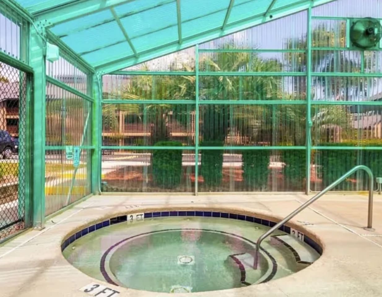 Jacuzzi in indoor pool area. 