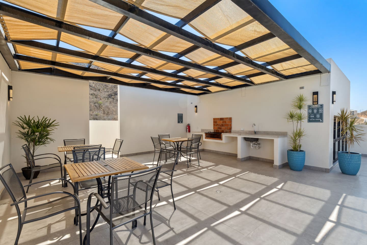 Outdoor kitchen and charcoal grill.
