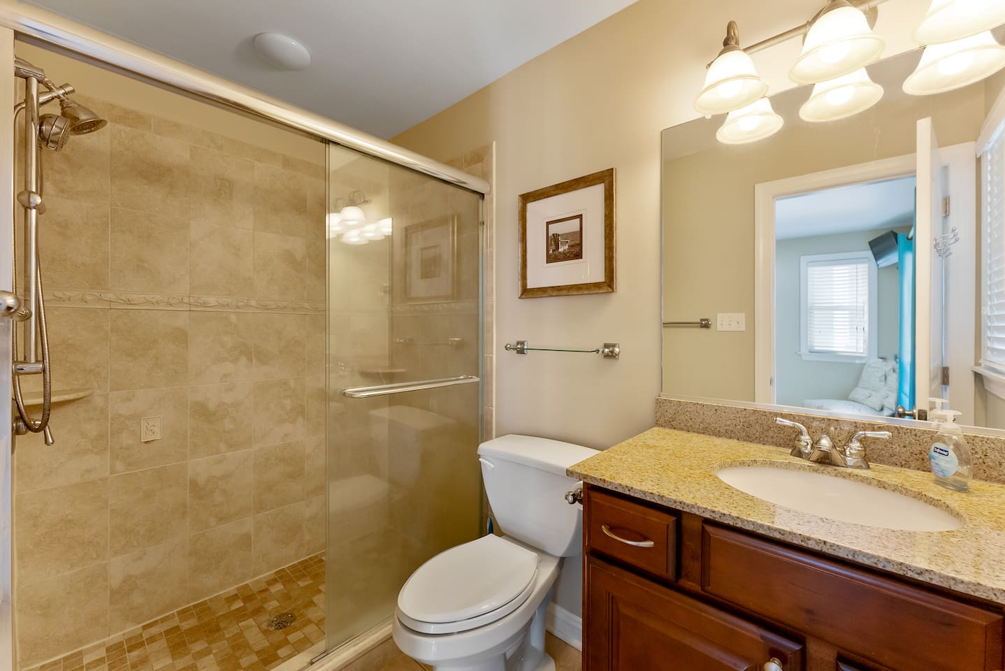 Private Full Bathroom with large vanity and large shower with glass doors. 
