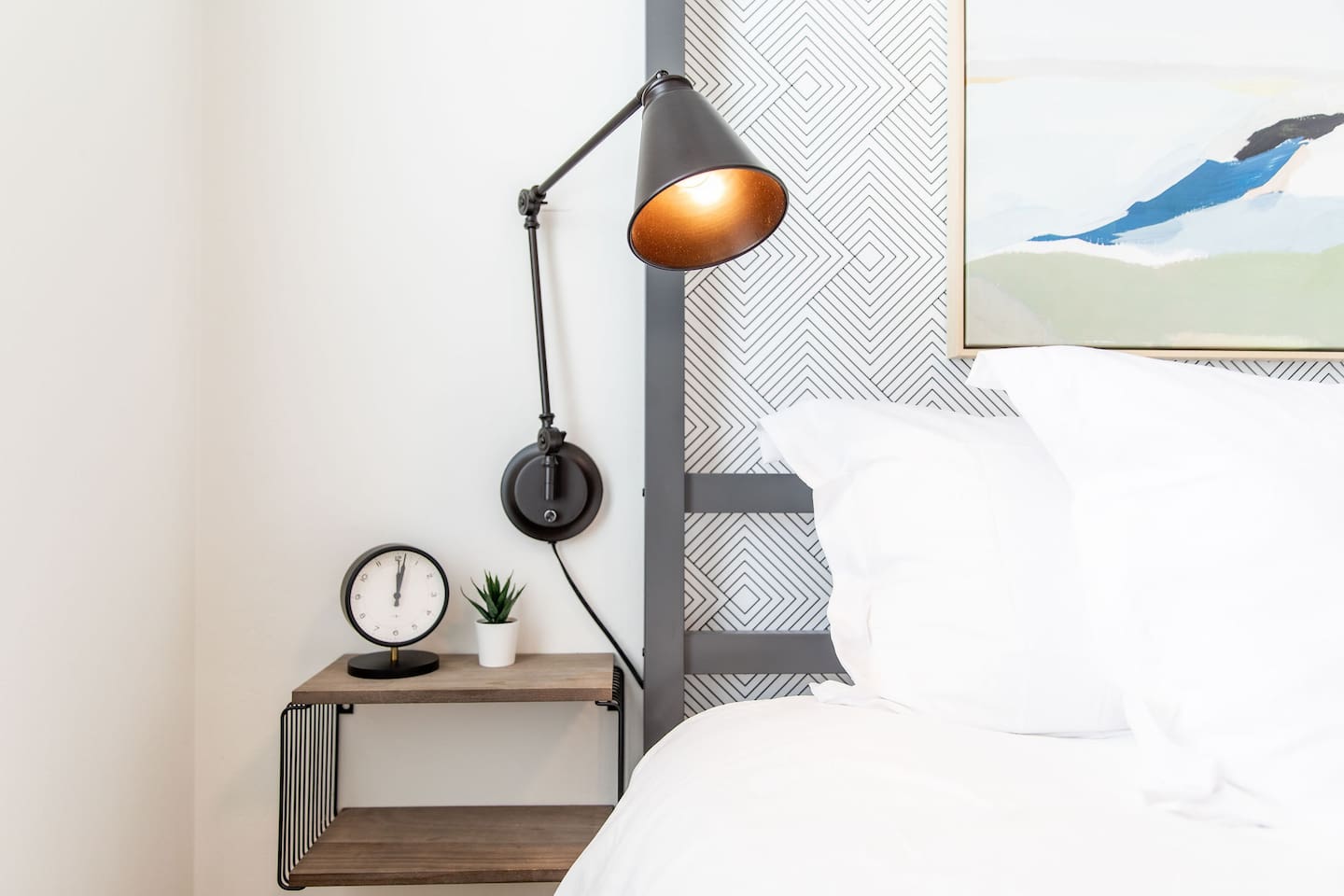 Elegant bedside table with a stylish side table lamp, providing both functionality and a touch of sophistication to the bedroom décor.