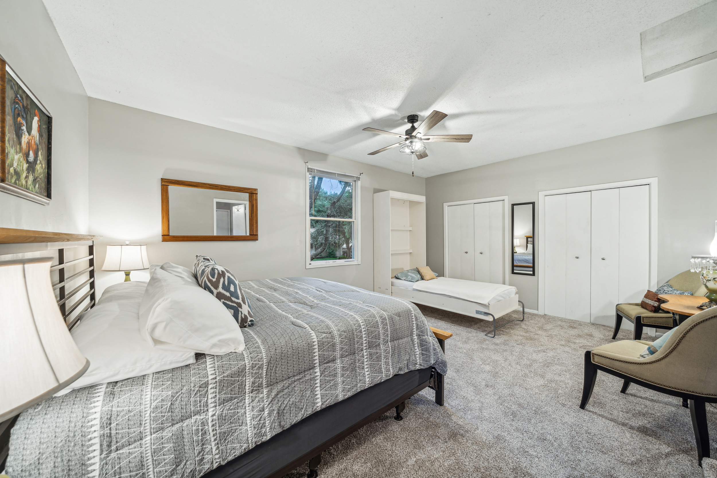 This spacious upstairs king bedroom has a private entrance door, dual closets and a bonus twin Murphy bed.