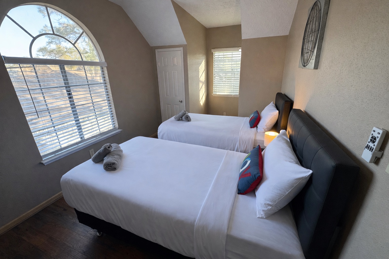 Two comfortable Twin beds in a bright and inviting space — ideal for children or solo travelers sharing a room.