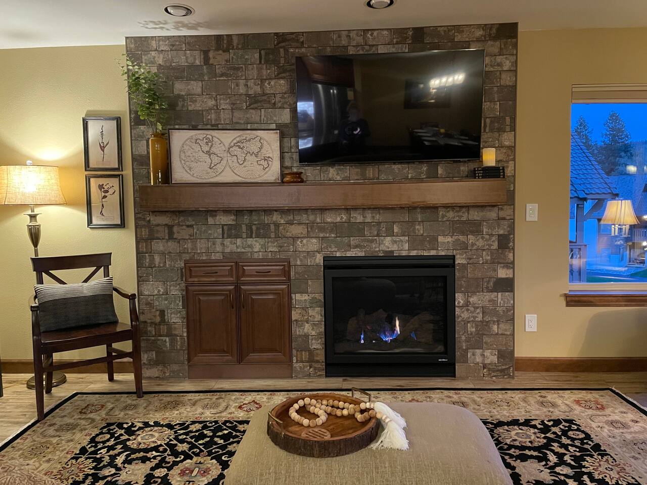 Living room with a gas fireplace and a 55” TV