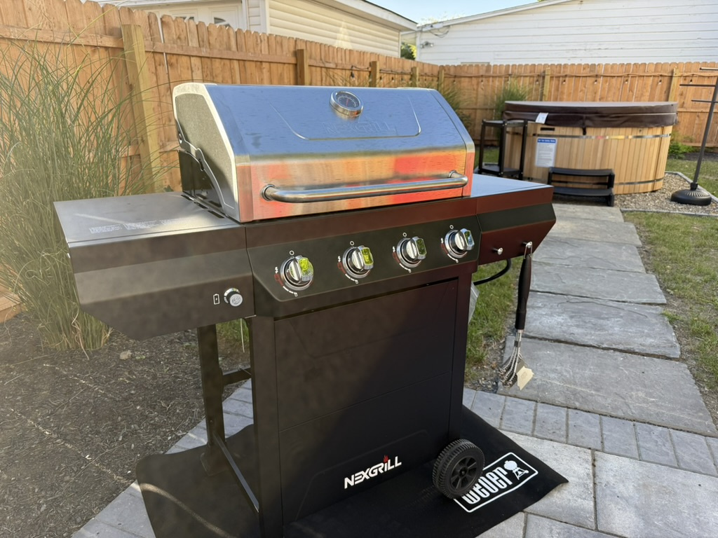 Dinner tastes better outside. Fire up the gas grill, gather around the outdoor dining table, and enjoy an easy meal together in the private backyard.
