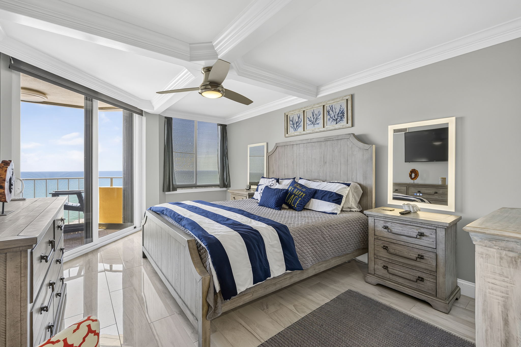 Primary bedroom with King Bed, ensuite bathroom and a private oceanfront balcony