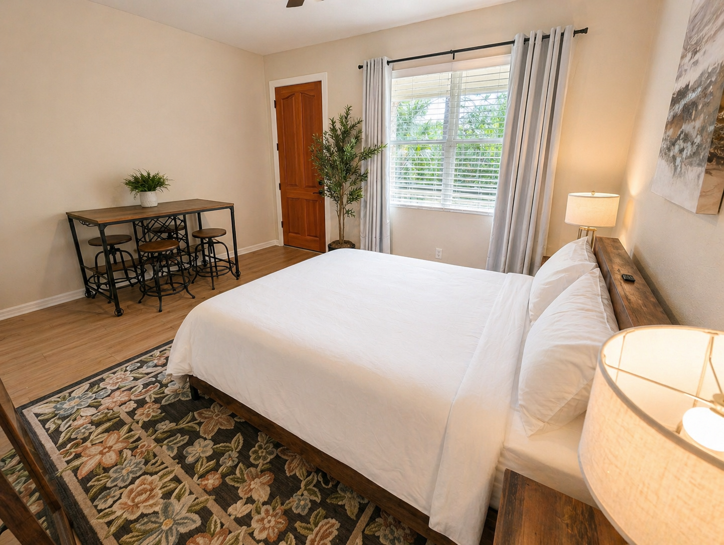 Cozy and well-appointed bedroom with a comfortable bed, soft lighting, and stylish décor. Enjoy natural light from the window and a calm, relaxing atmosphere perfect for a restful night’s sleep.