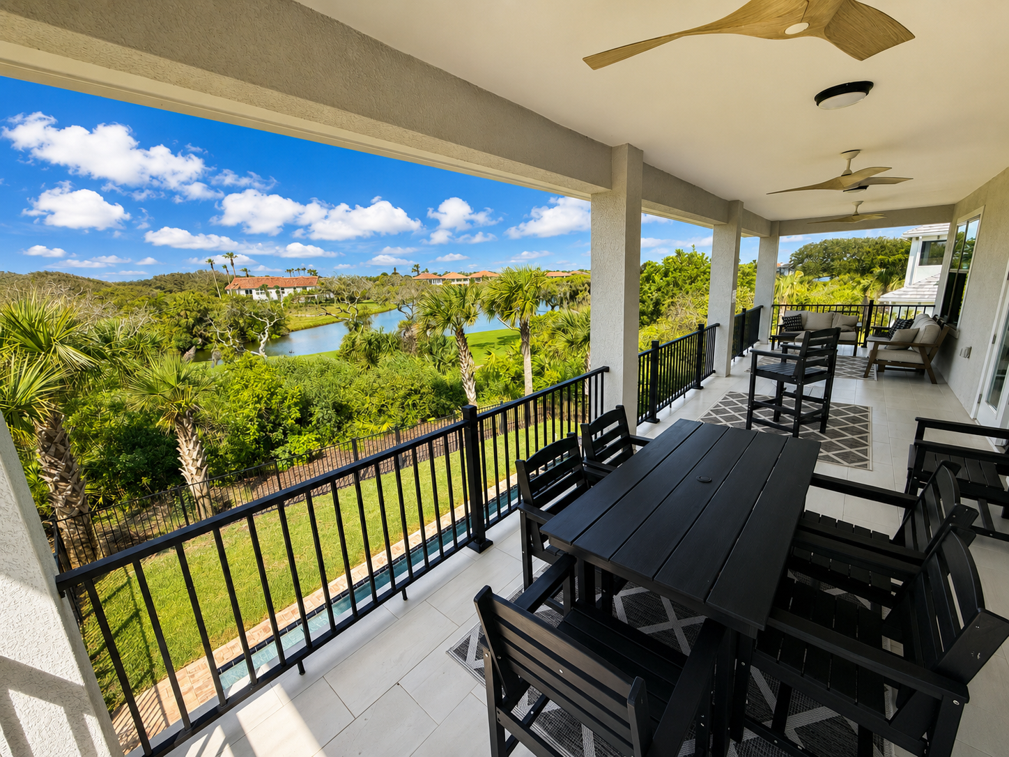 Wide open to the breeze and the sweeping golf-course view, this covered balcony is where your family will gather most. Morning coffee, afternoon card games, sunset dinners—pull up a chair, settle in, and let the good, slow hours simply roll by.