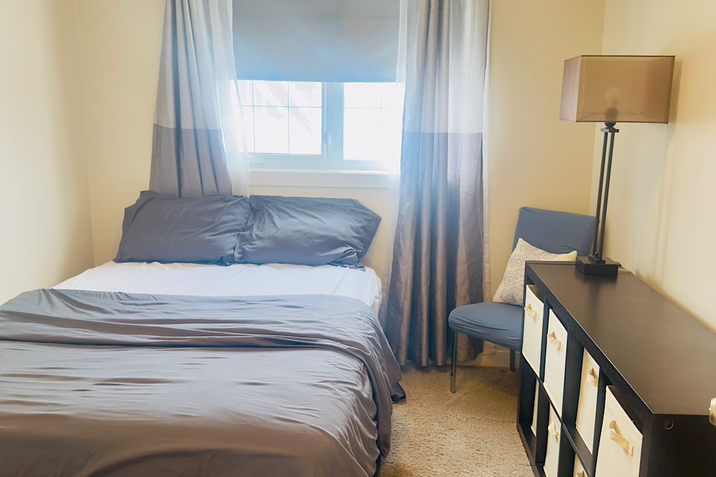 Queen sized bed, full closet and black out curtains.