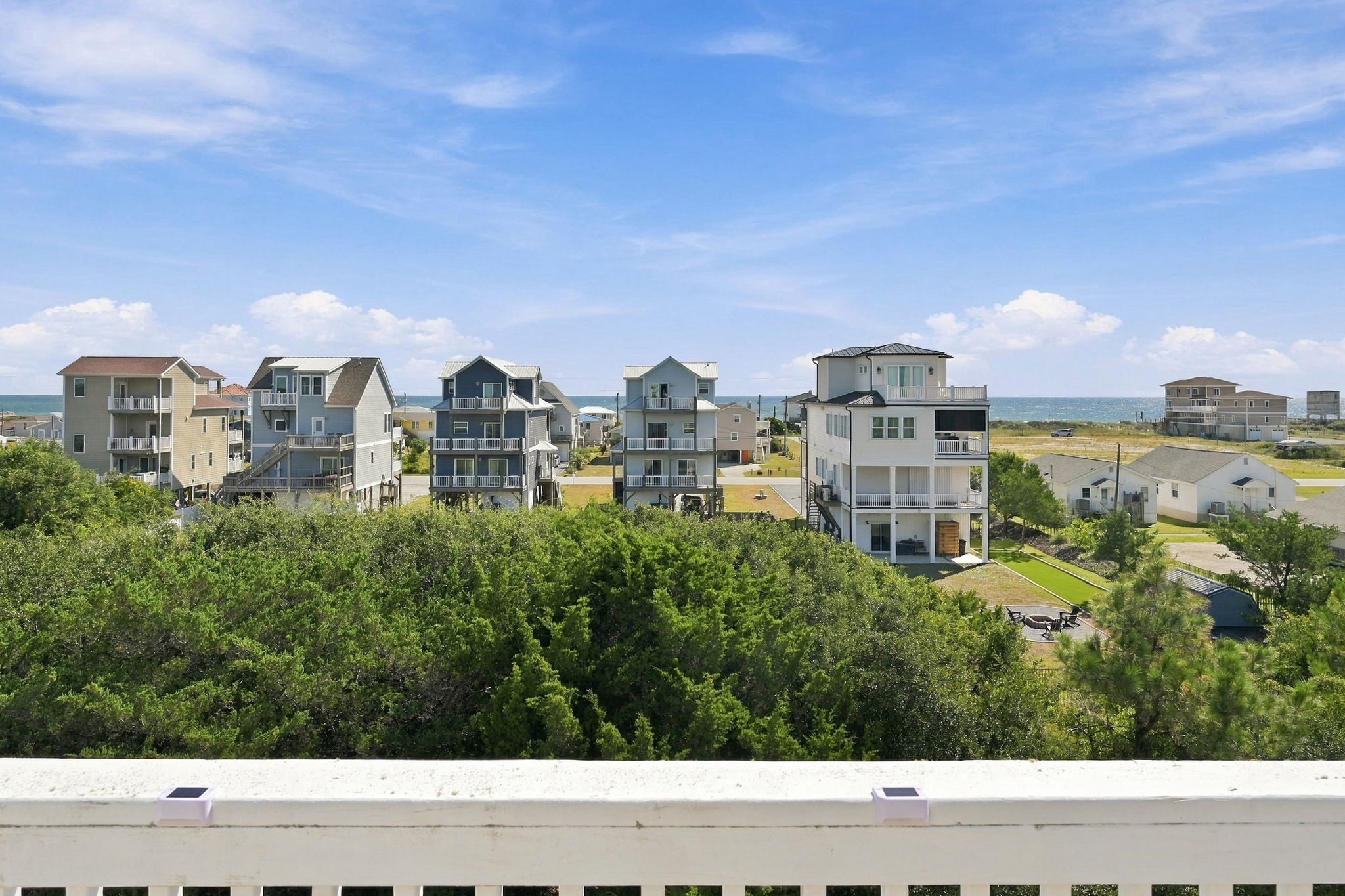 Elevated views overlooking the surrounding coastal neighborhood and lush greenery