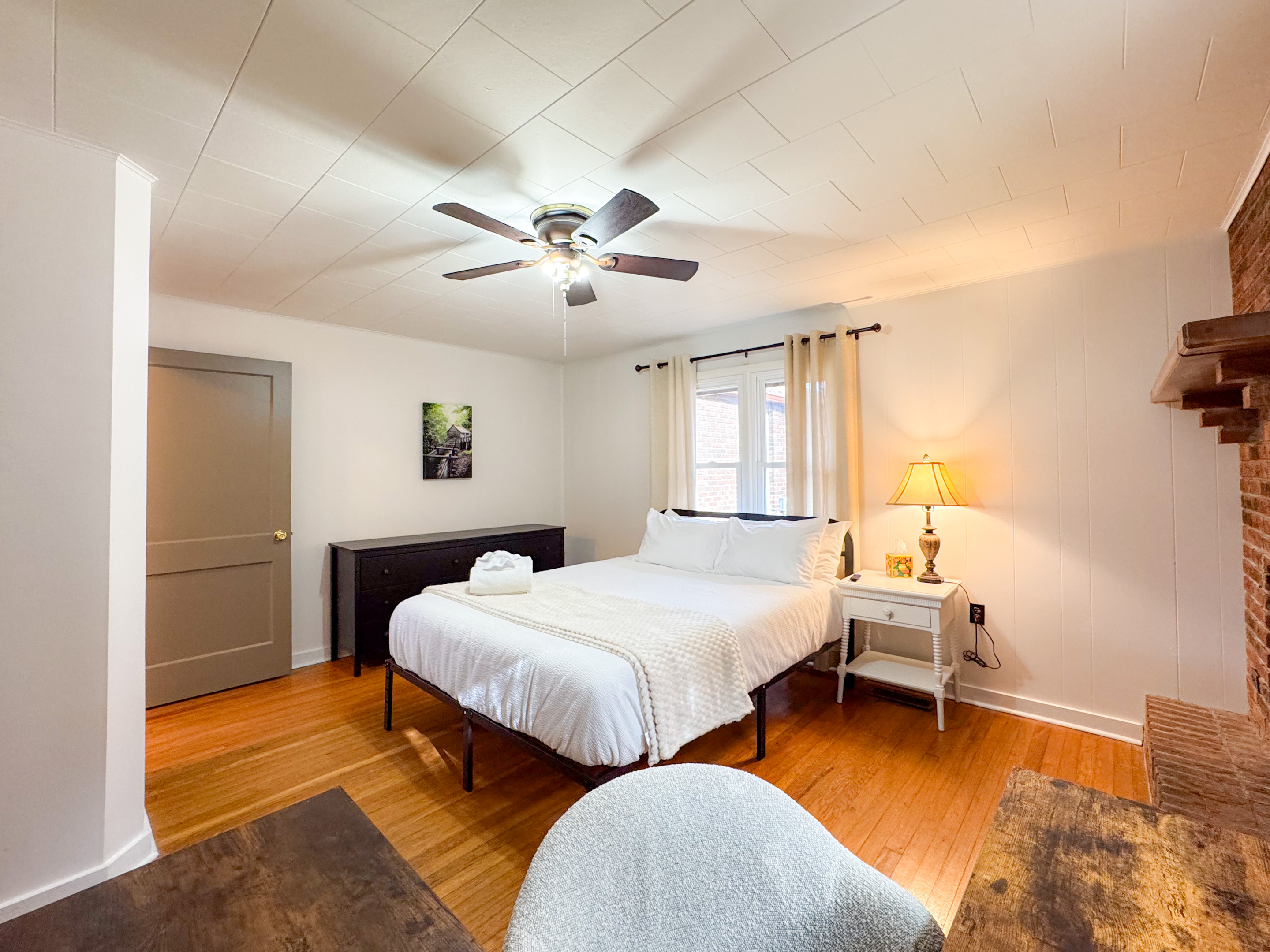 Our second guest bedroom features a queen size bed with comfy, high thread count linens and shredded bamboo pillows! The beds are cooling memory foam with a medium firm feel. Please note the fireplace is not a functional fireplace. 