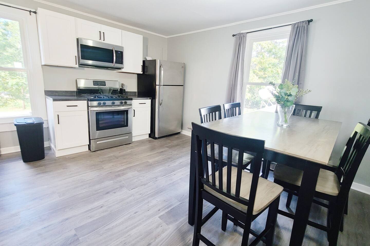 Stylish 6-seater dining area facing the kitchen, creating an open and inviting space perfect for meals and entertaining.
