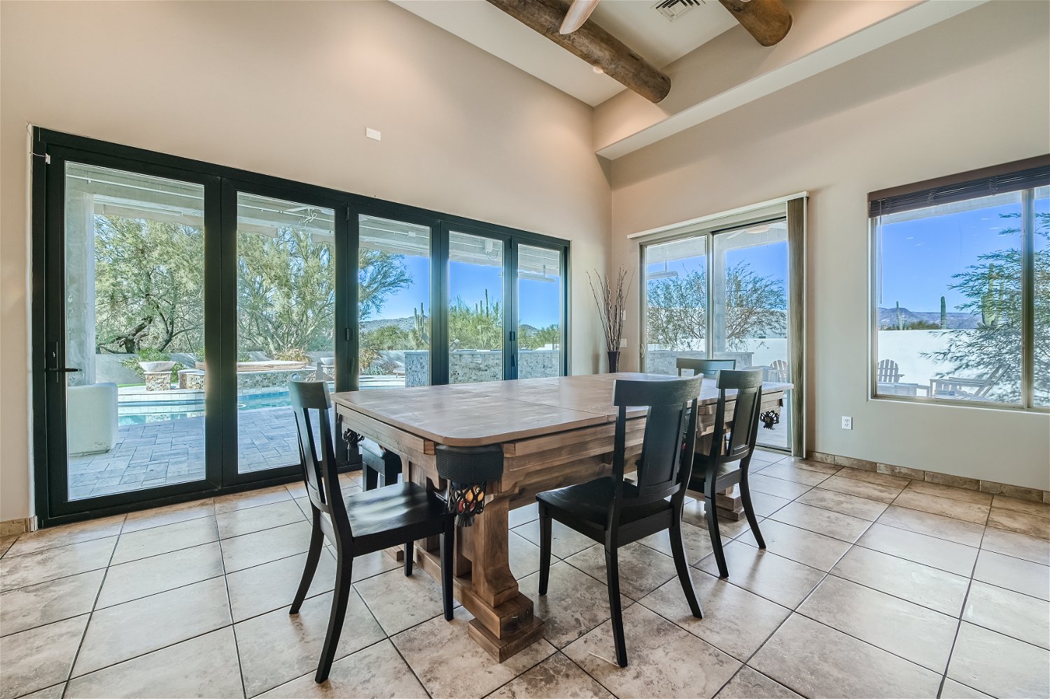 Dining area bench seating and four chairs (pool table underneath)