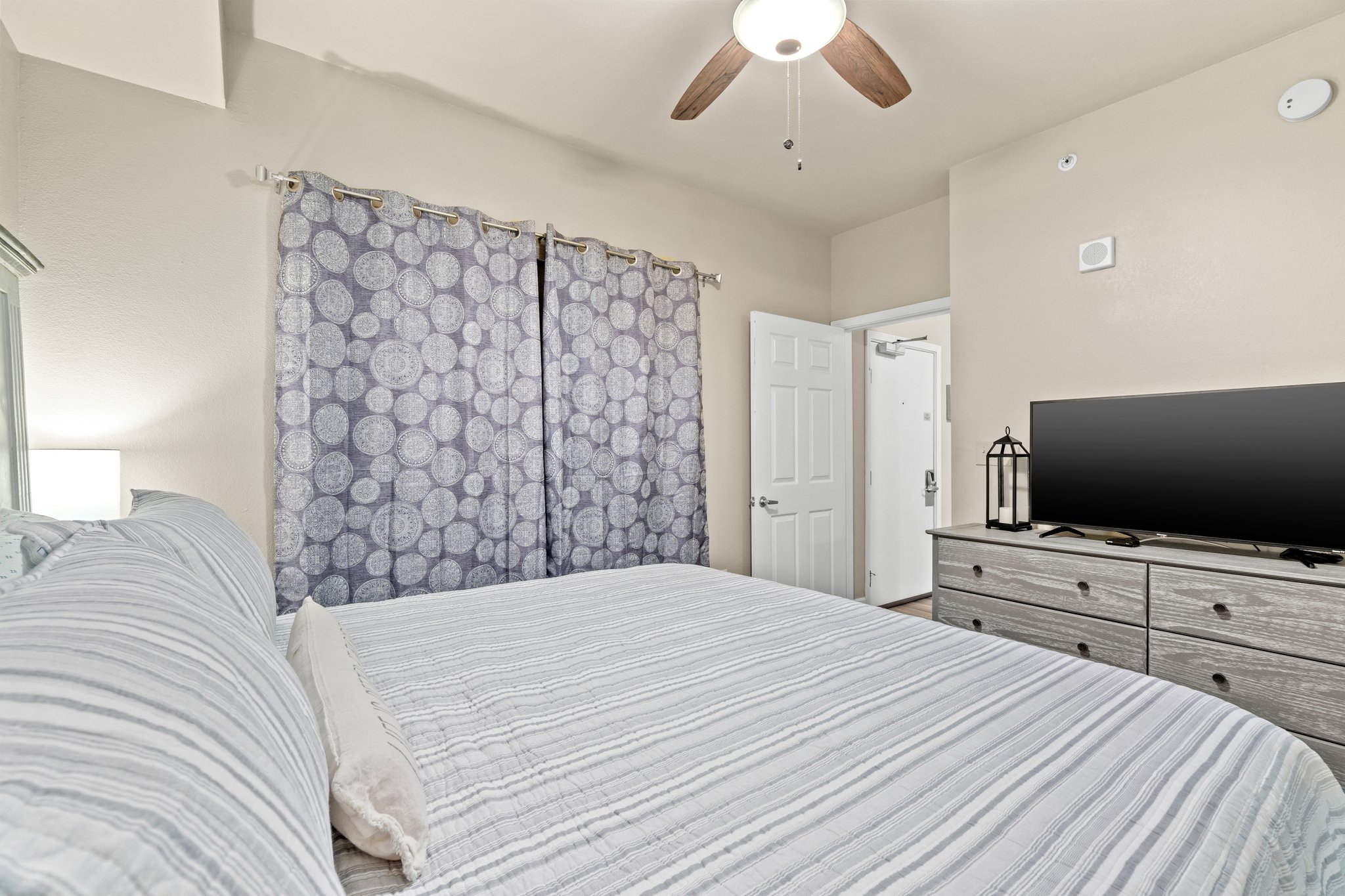 Plush king bed, black out curtains, and smart tv in the master