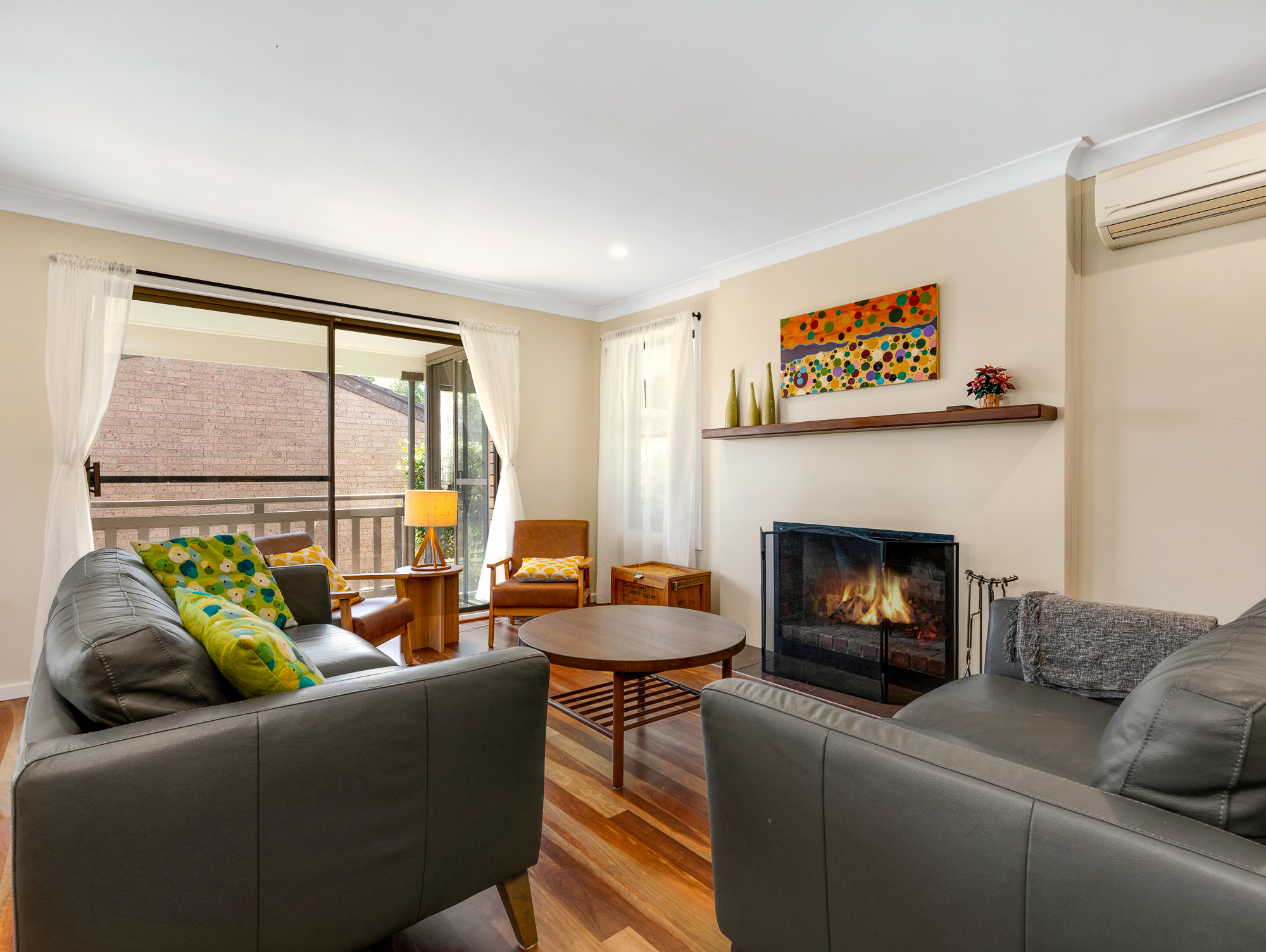 Upstairs lounge room with open fire.