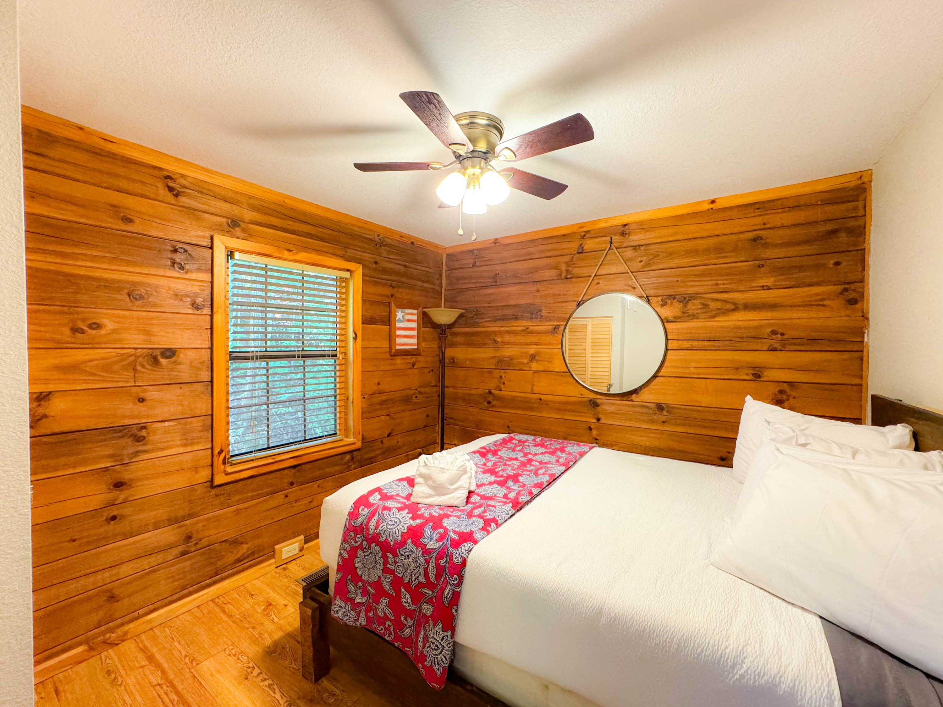 Main level bedroom featuring a queen bed