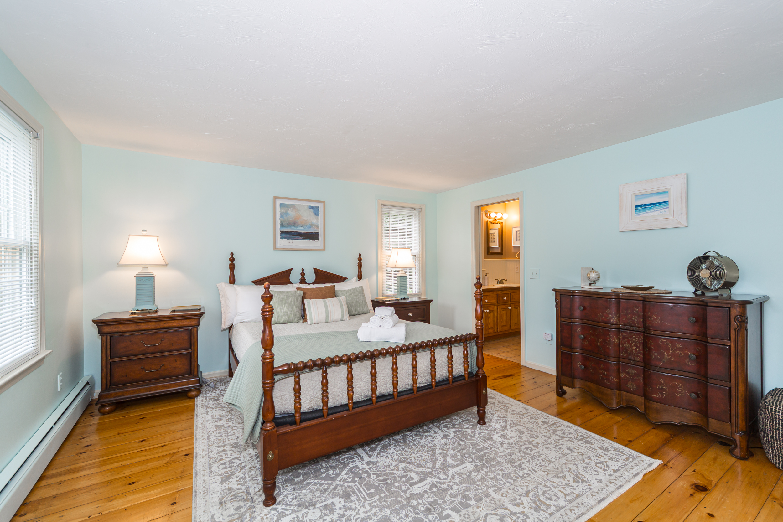 Main floor bedroom with queen bed and shared ensuite