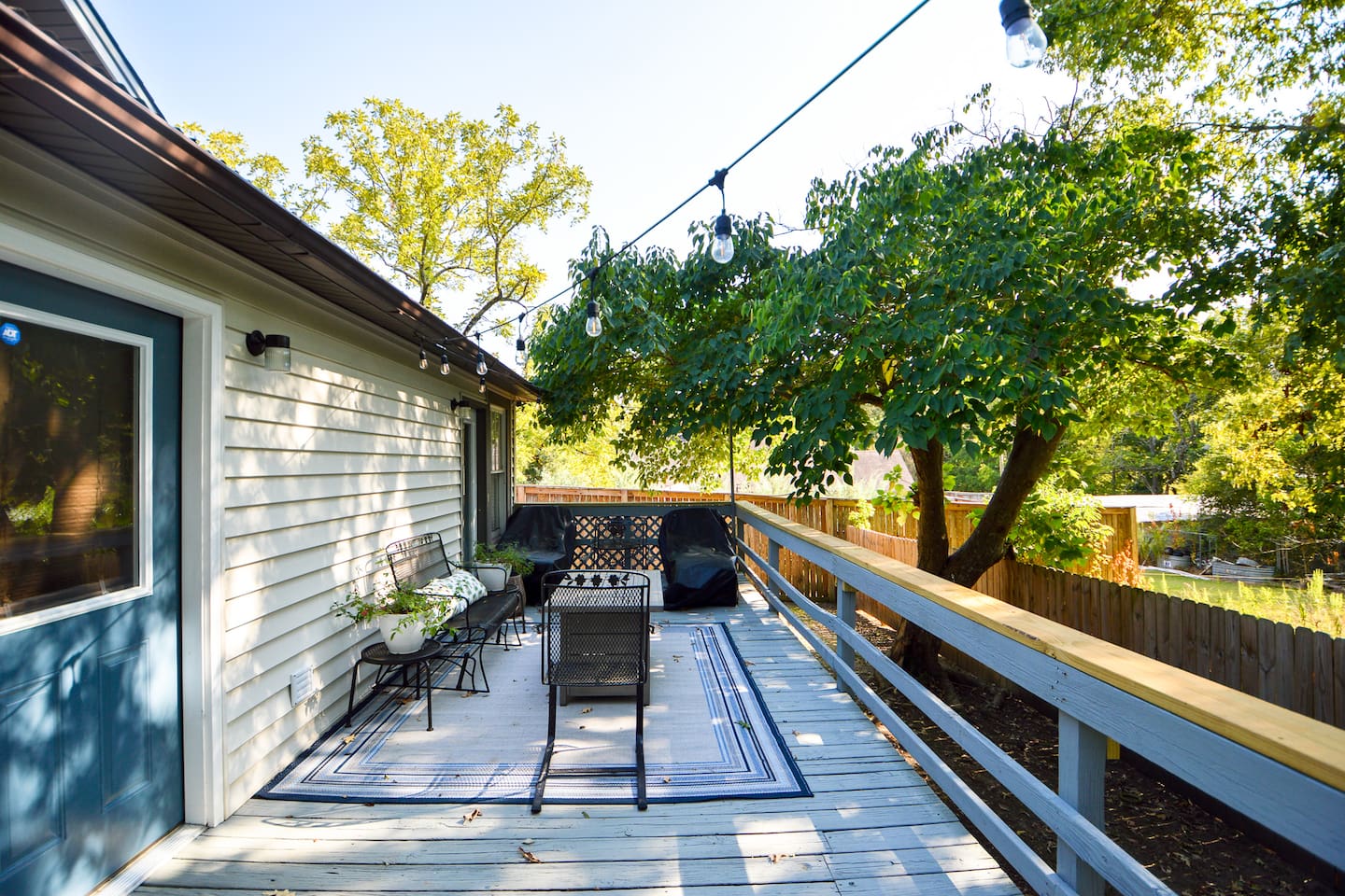 Back Patio with firepit and string lighting