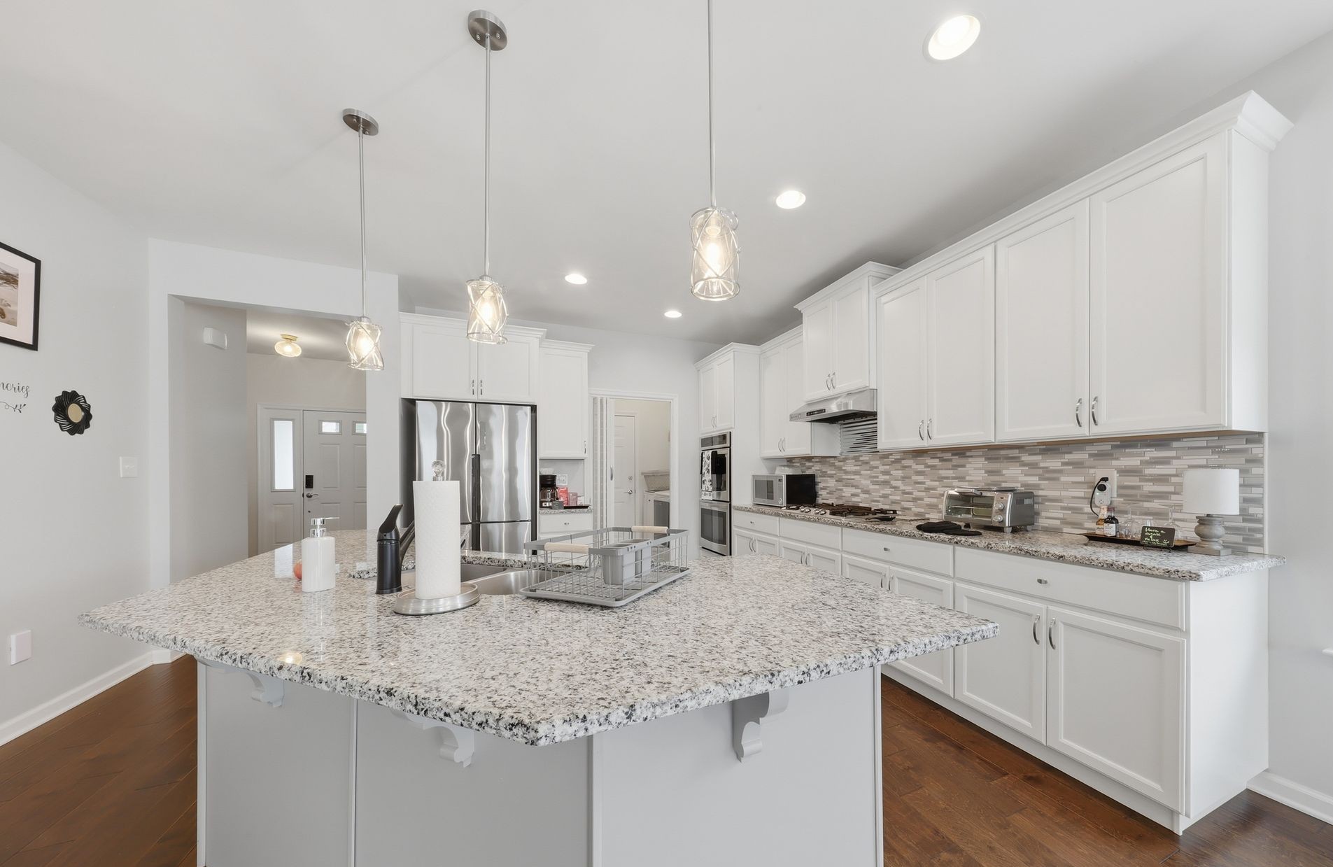 Stainless steel appliances, granite countertops and real wood cabinets