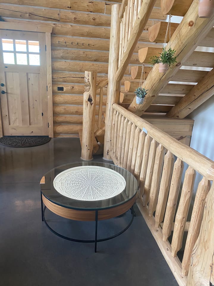 Sisyphus table in the open concept living room. (Instructions on how to change designs in the house manual)