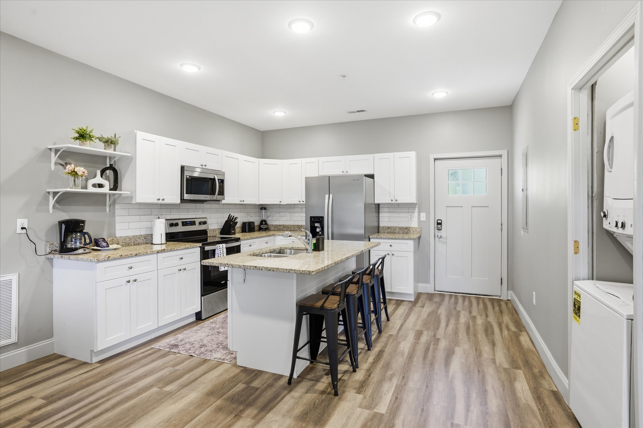 Gather here first—set the snacks out, open the fridge, and make yourself at home. With stainless appliances and plenty of counter space, this kitchen is ready for everything from quick bites to full meals.