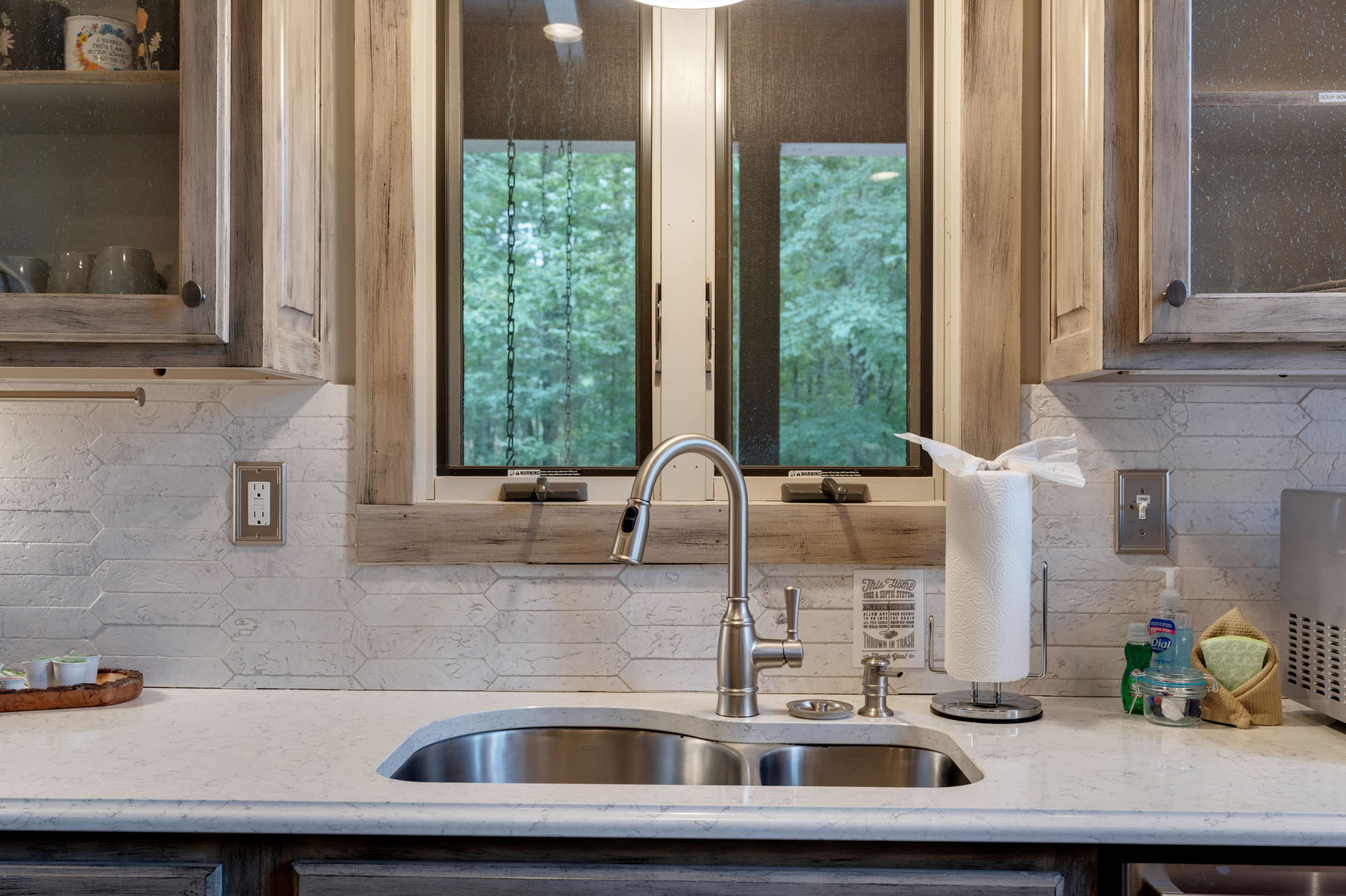 Kitchen sink.  Starter supplies provided like paper towels, dishwasher pods, sponges, dish soap, etc.