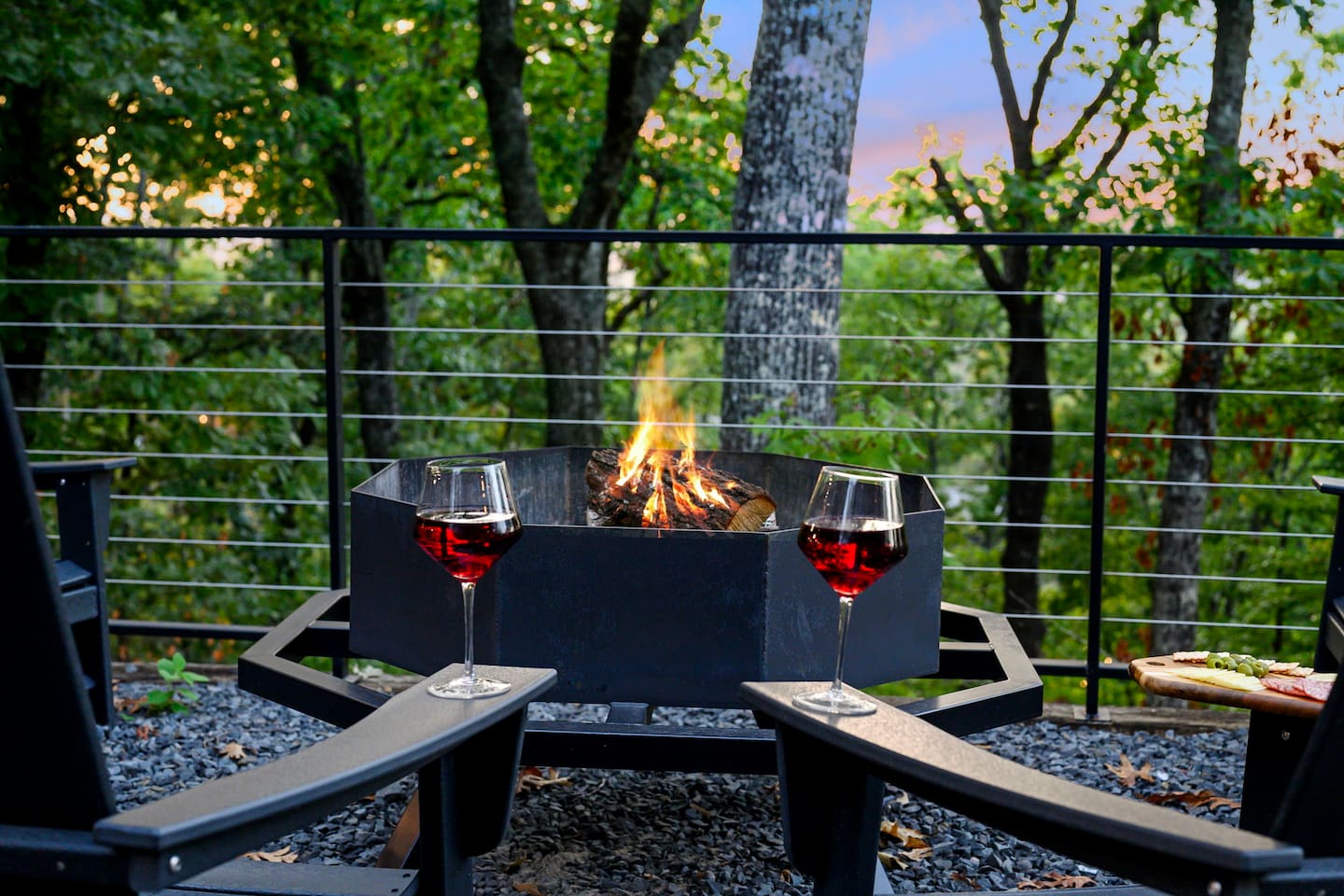 Gather around the fire pit high above the trees, with sweeping forest and mountain views creating the perfect backdrop for cozy evenings under the stars.