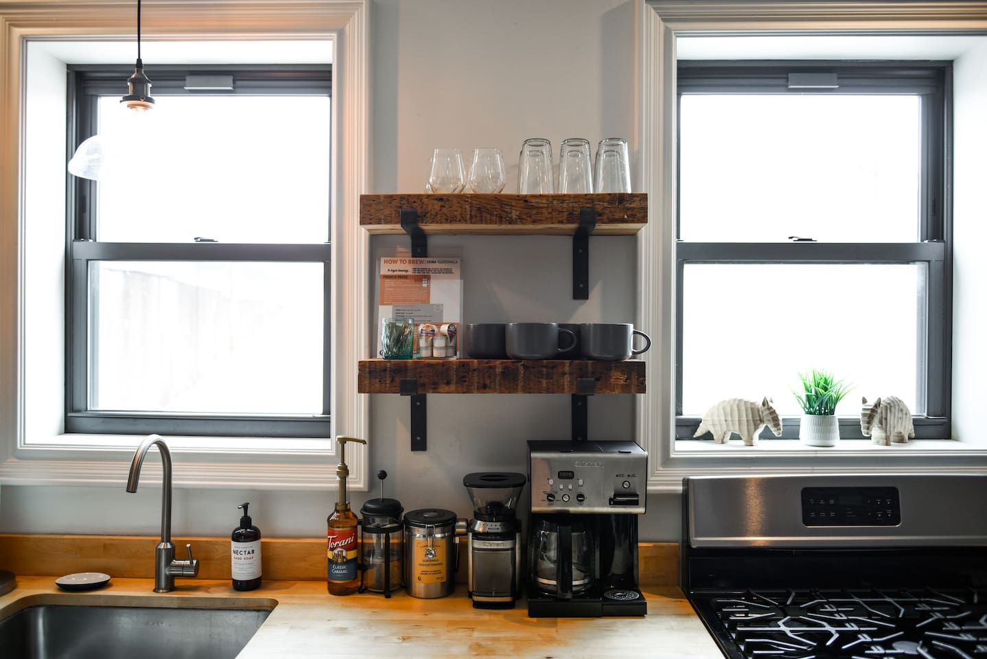 Fully equipped kitchen featuring modern design and sleek stainless steel appliances — ready for all your cooking needs.