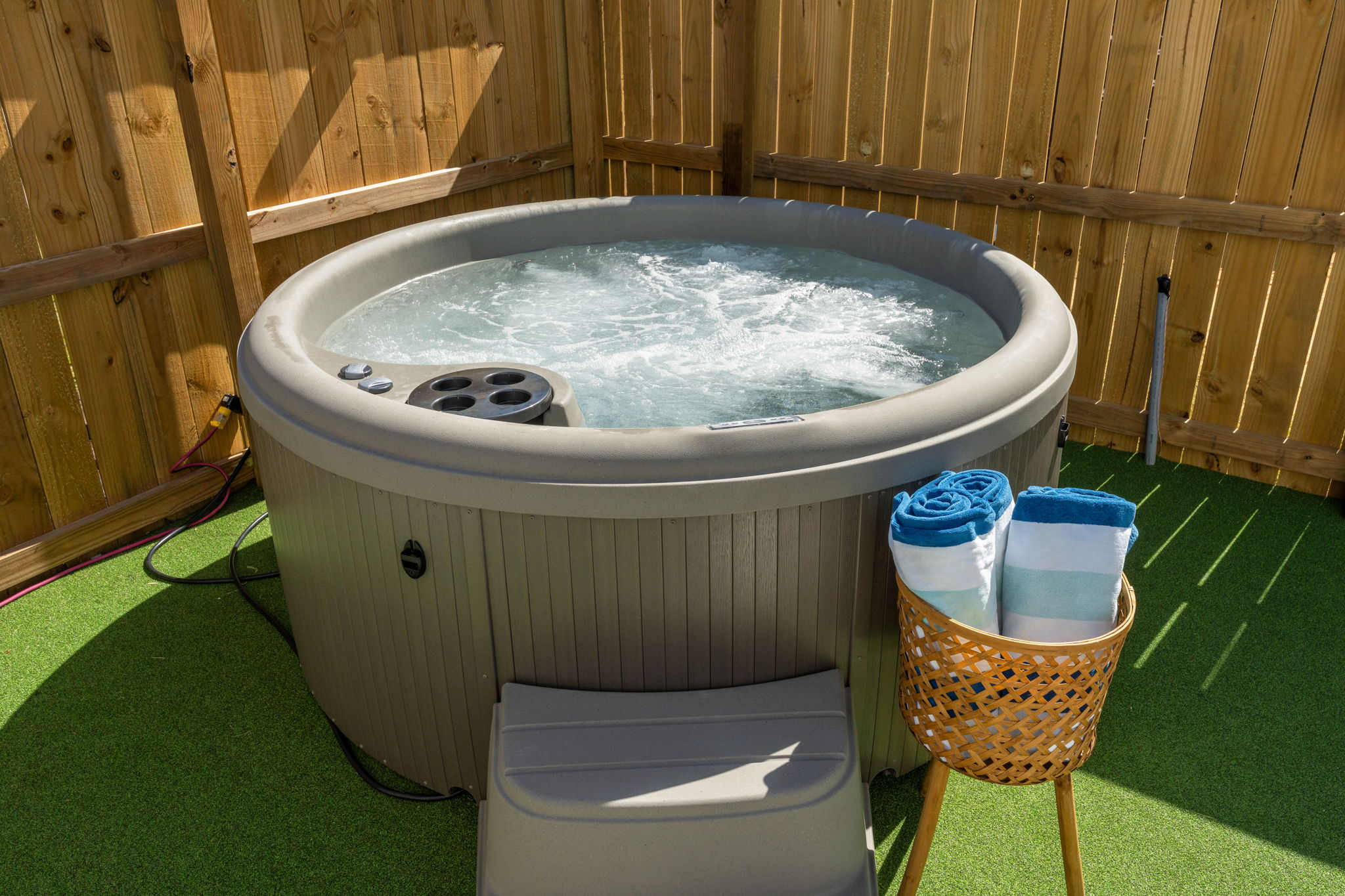 Unwind after the beach in your private hot tub.