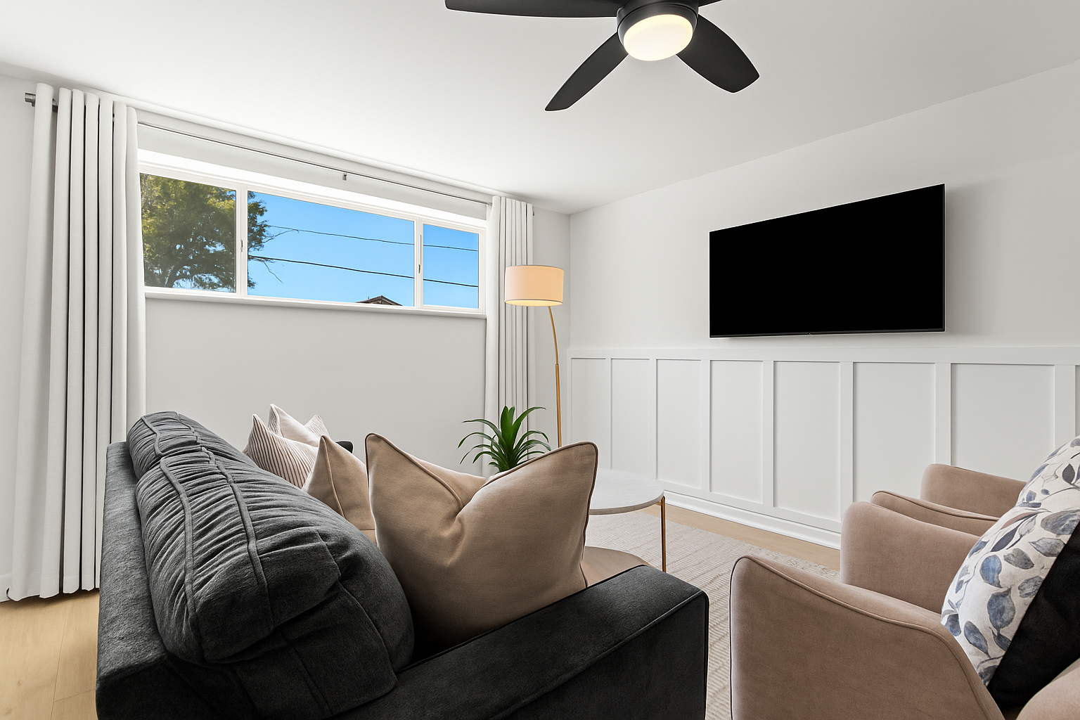 A perfect blend of comfort and design, this living area includes ample seating and direct views of the flat-screen TV.