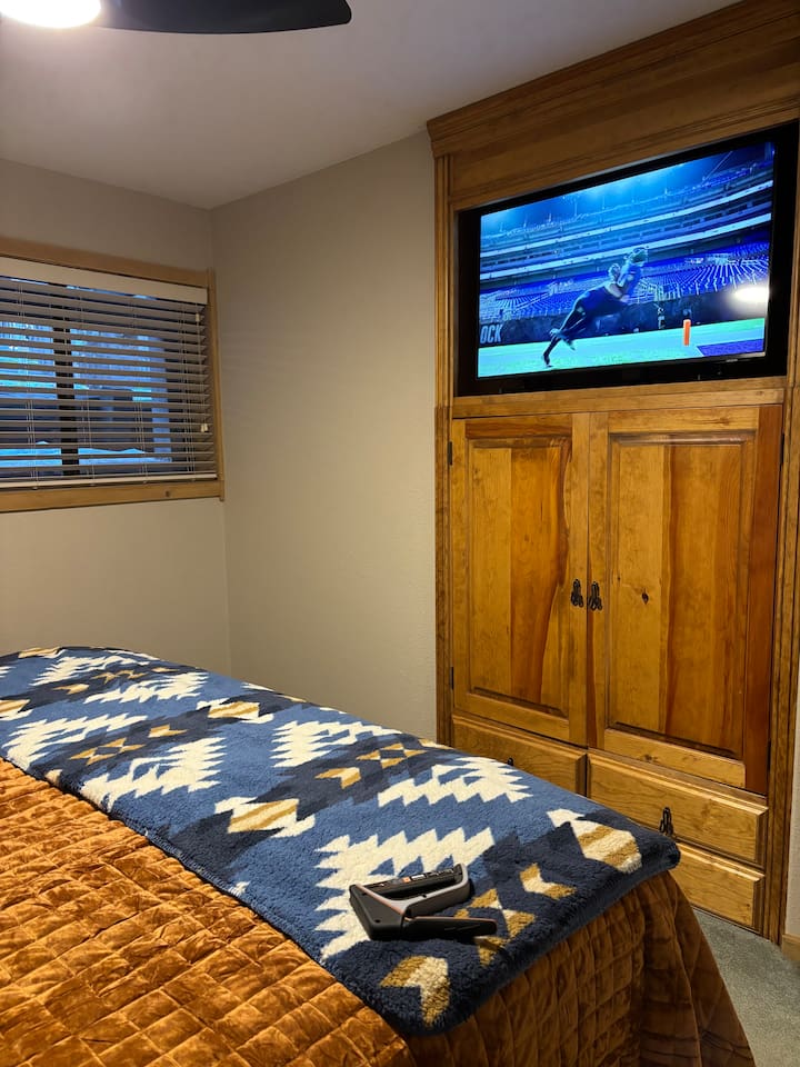 Guest Bedroom - Brand new 43 inch Smart TV with built in cabinets for clothing storage.