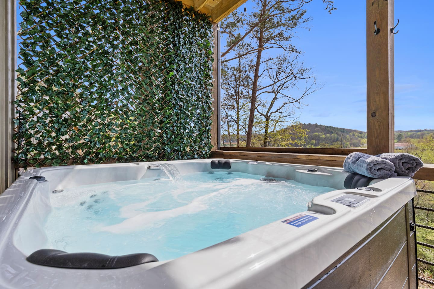 Relax in our private 6-person hot tub with powerful hydrotherapy jets, a soothing waterfall, and vibrant changing LED lights. Surrounded by lush privacy greenery with stunning views of rolling hills and trees. Towels provided. Pure relaxation awaits!
