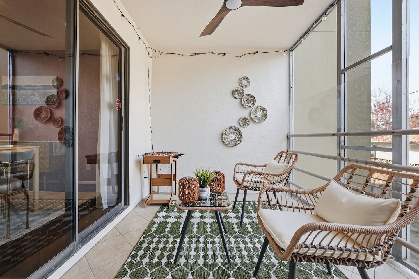 Spacious private balcony with direct access from the kitchen and Bedroom 4, complete with cozy string lights and a mini foosball table — perfect for evening gatherings or casual games.