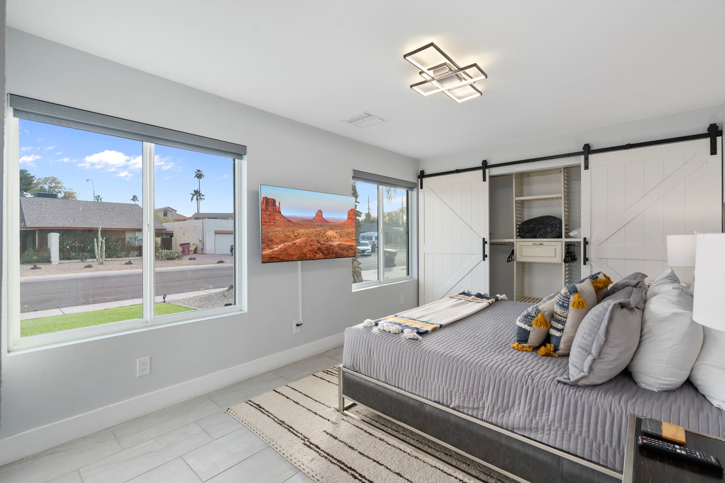 Natural light pours in through two wide windows, enhancing the openness and creating the perfect morning wake-up glow.