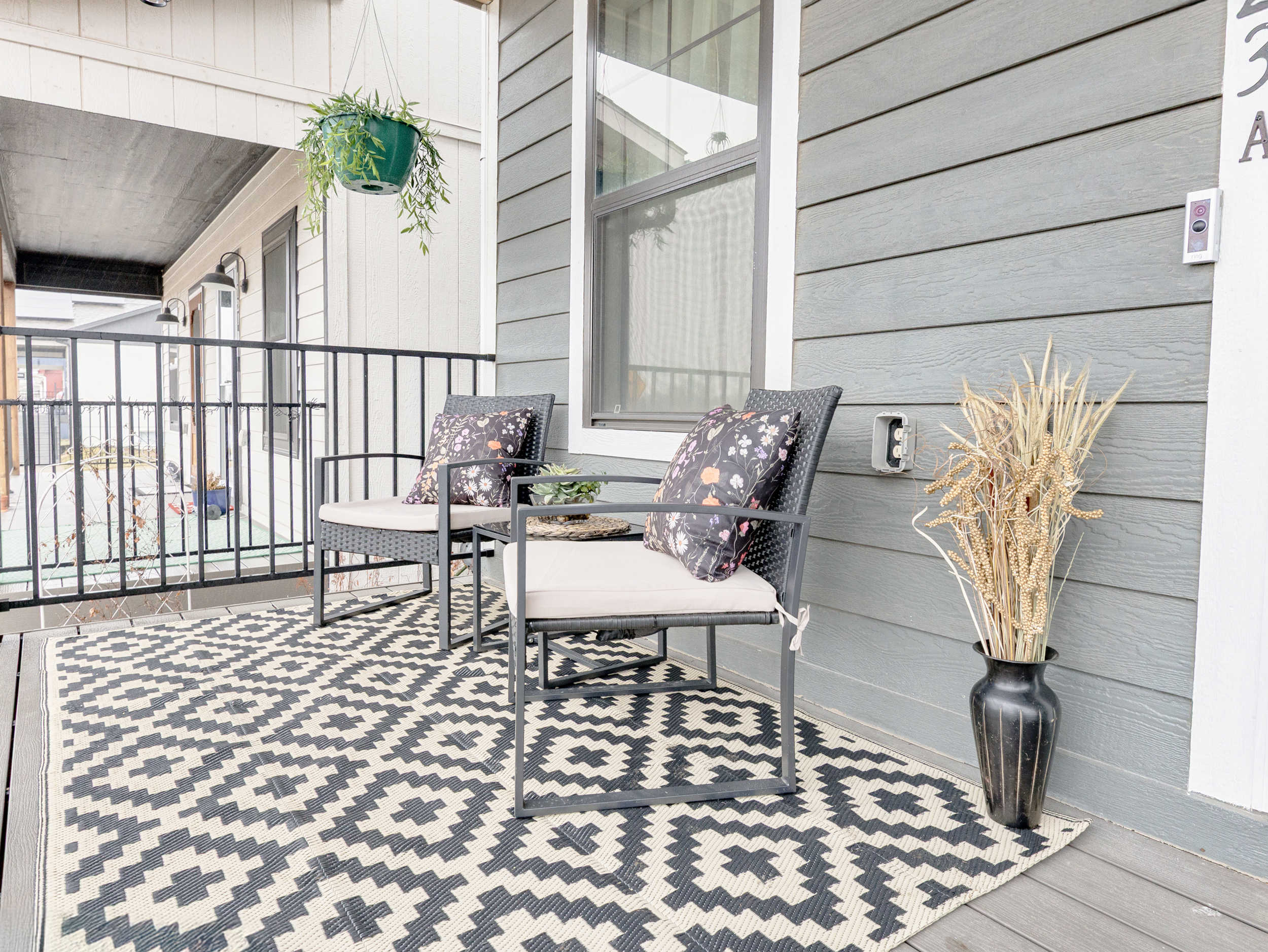 Covered front porch offering a comfortable outdoor retreat—ideal for morning coffee or unwinding in the evening.