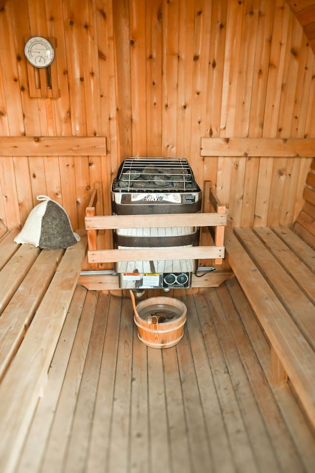 Outdoor barrel sauna with eucalyptus oil provided. 