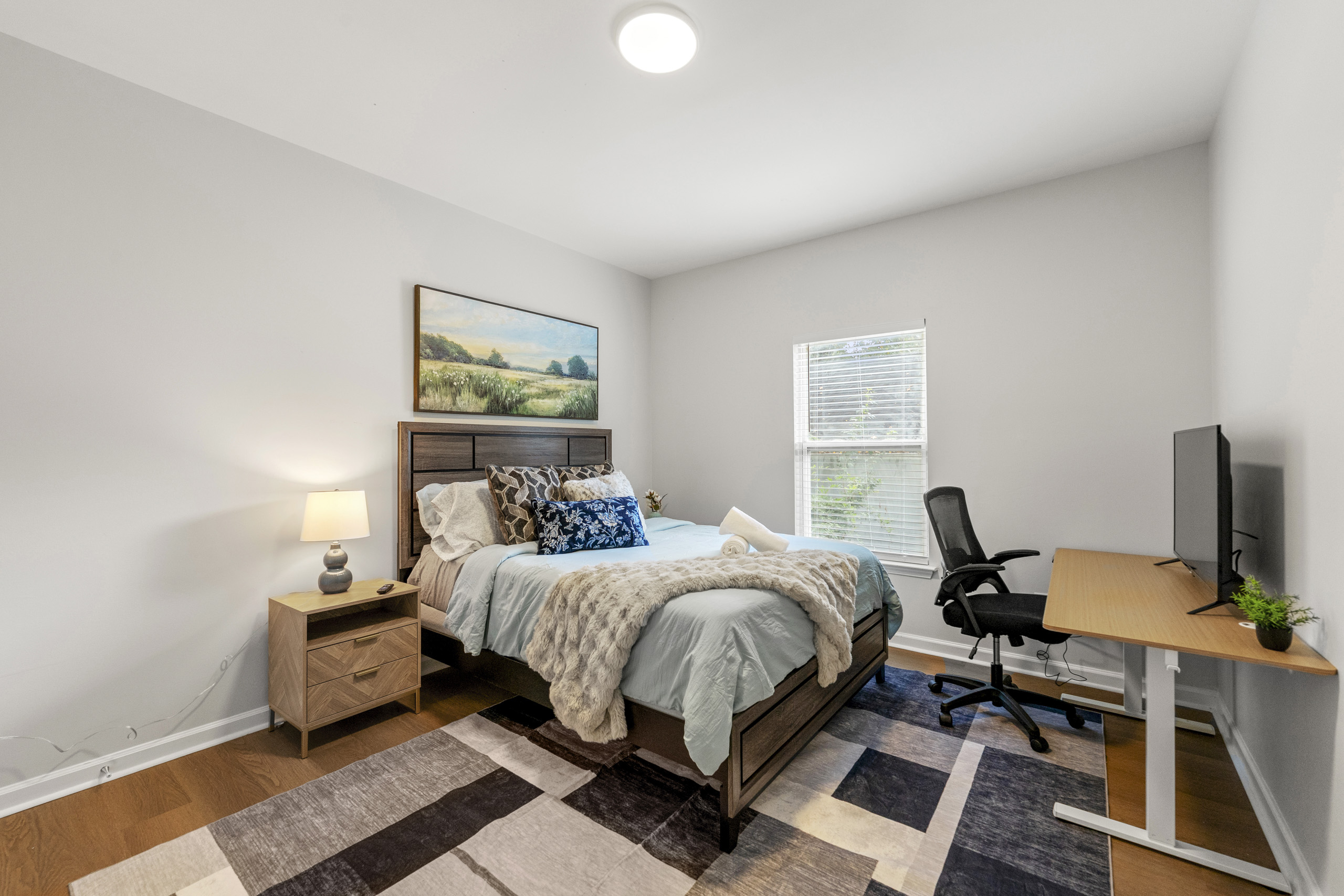 Bright and cozy bedroom offering comfort and simplicity for a restful stay.