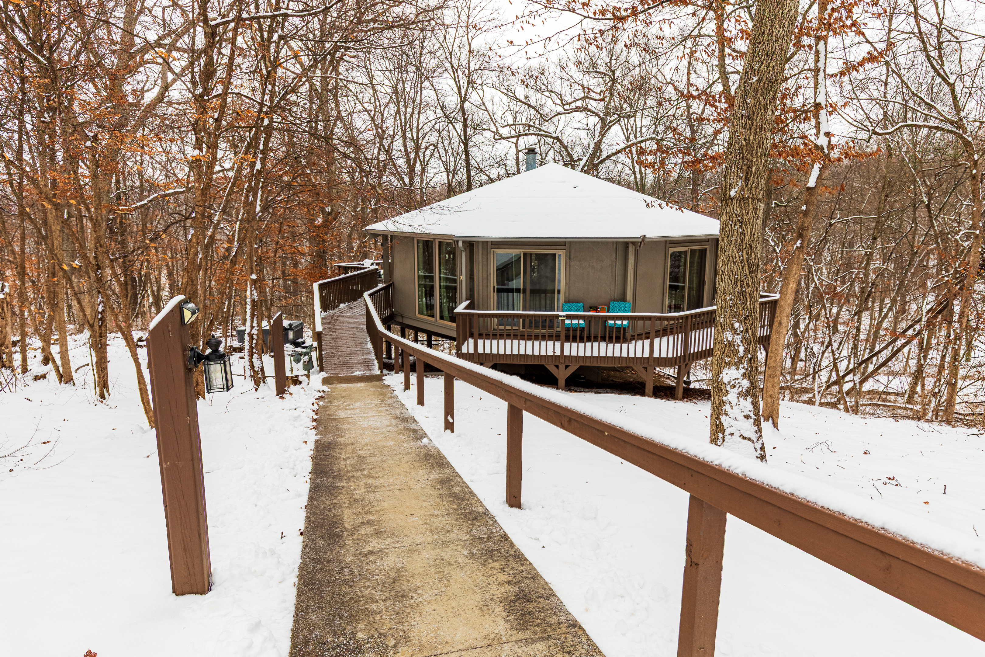 Front of this fun octagon "tree house" the Retro Nest- has 2 steps, then long ramp to house