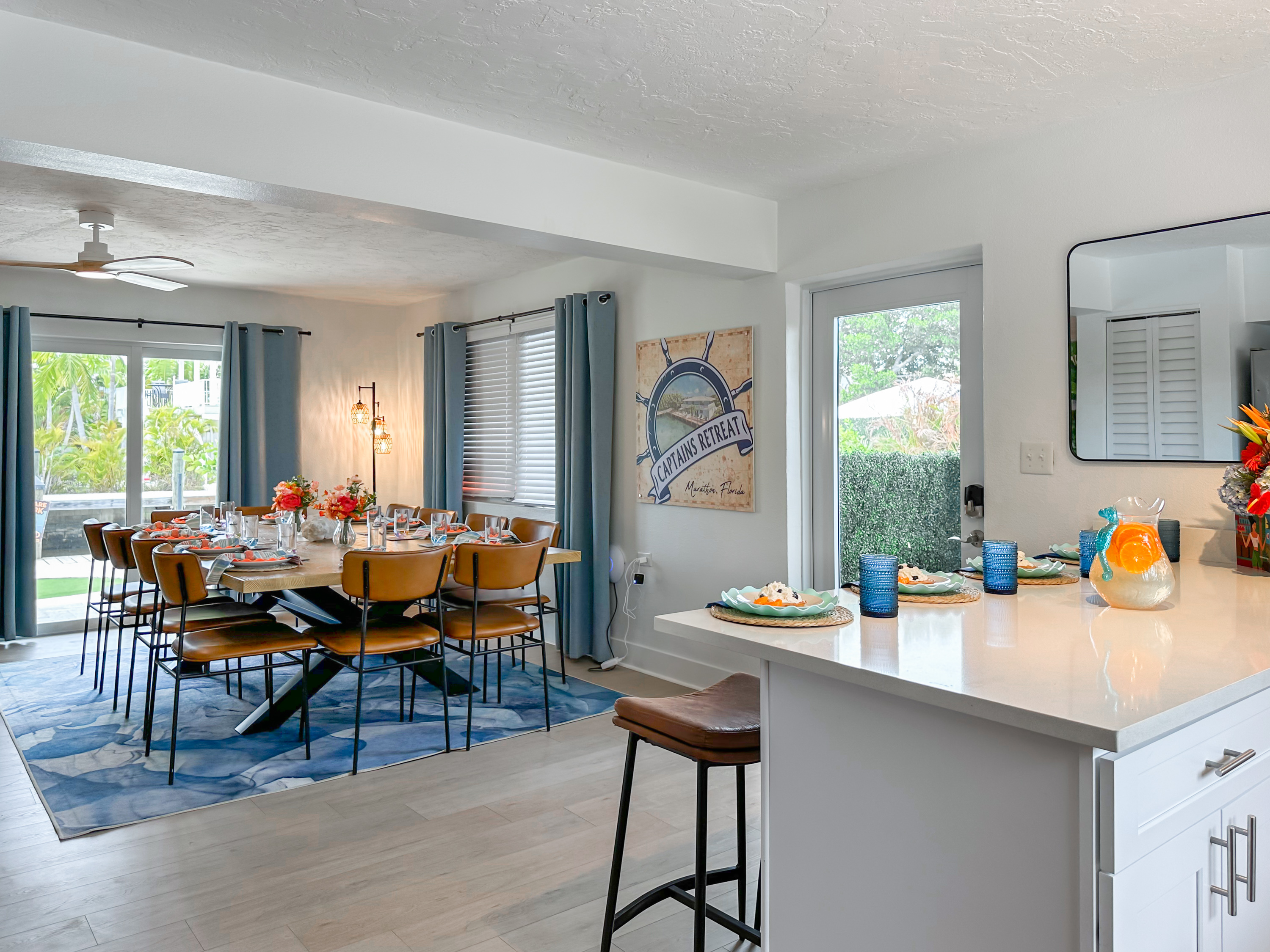 The sliding doors by the dining table open up to the canal side putting green and BBQ area.