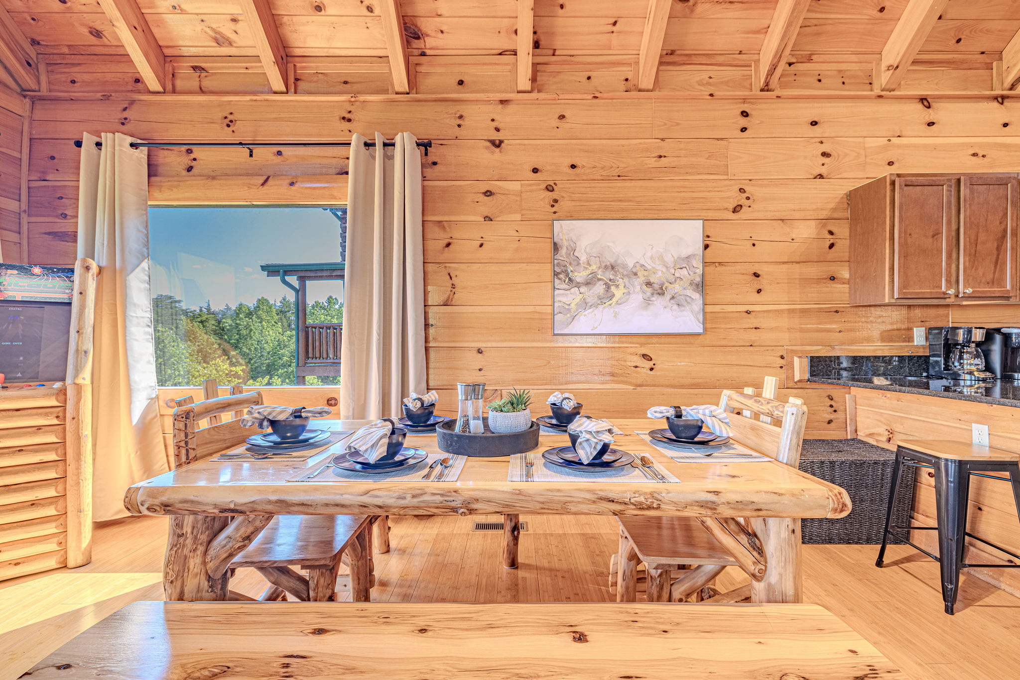 Gather 'round! Our dining table offers seating for six, plus extra spots at the breakfast bar – perfect for meals, games, and conversations.