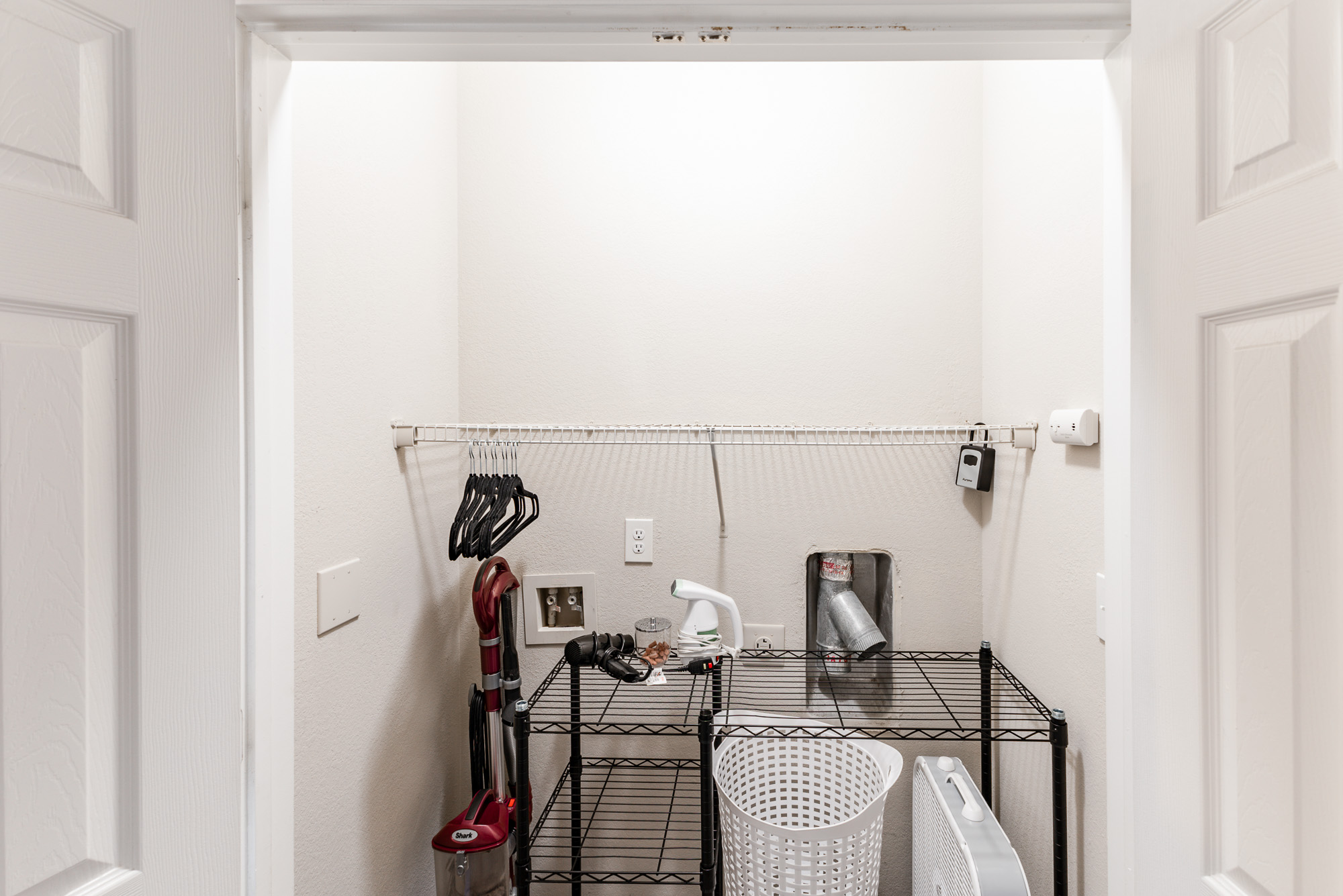 closet with hair dryer and steamer