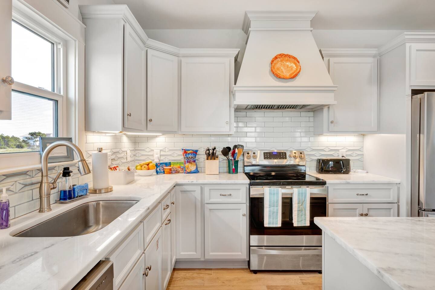 Kitchen with stainless steel appliances and an induction stove