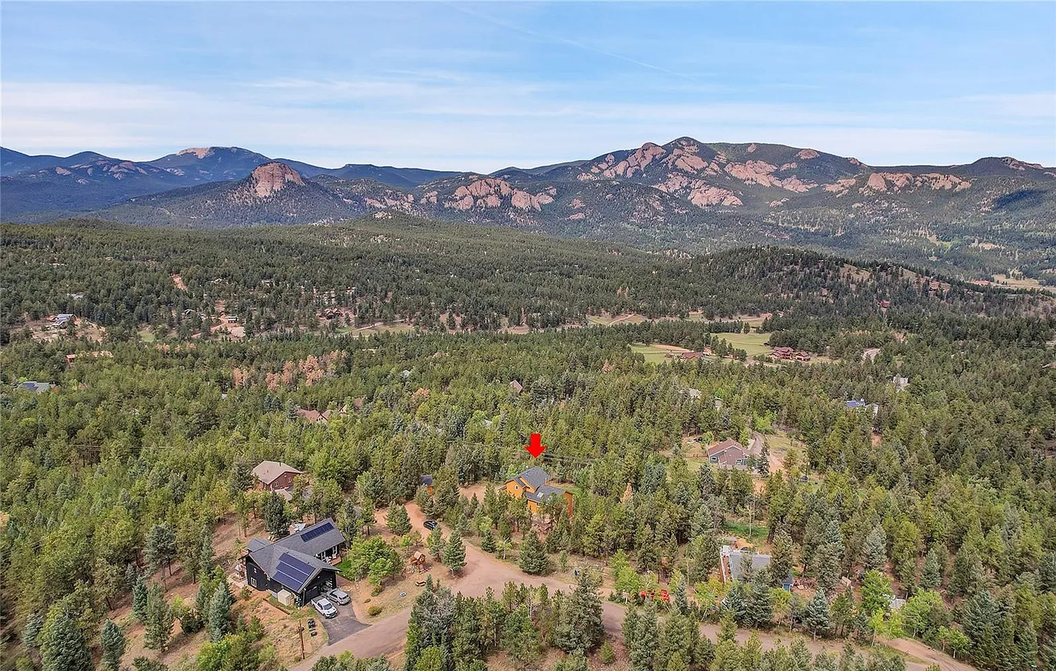 Sweeping panoramic views of the surrounding mountains and valleys from above.