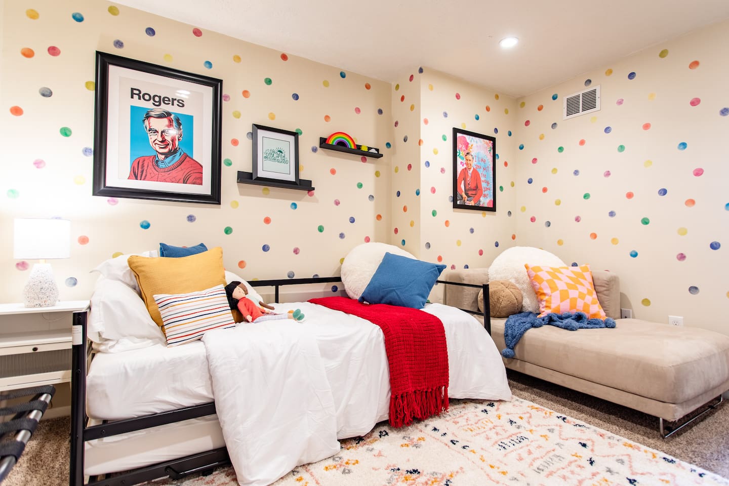 Bright and cheerful bedroom, thoughtfully designed for kids with TV and plenty of natural light and a playful, comfortable atmosphere.