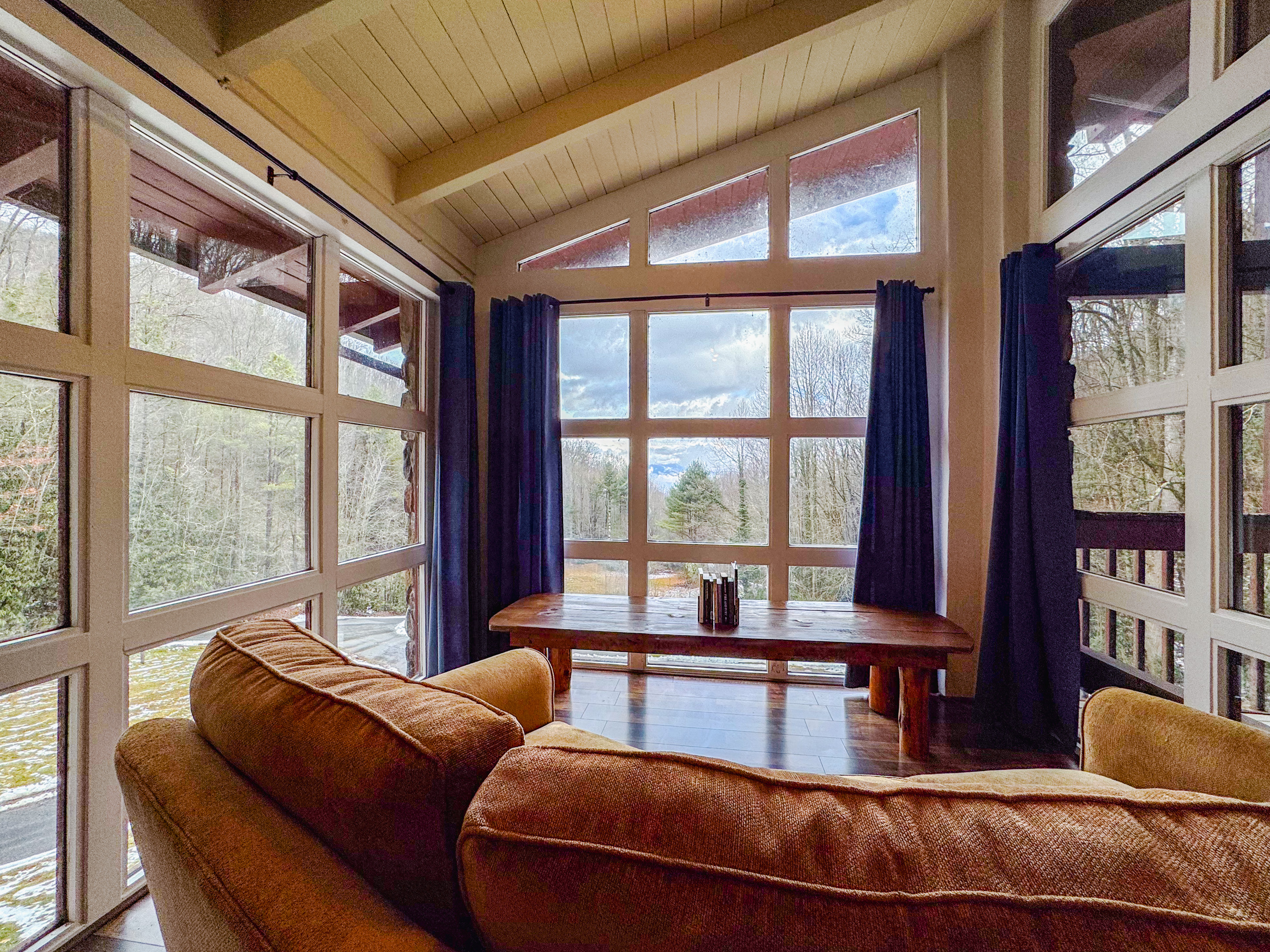 reading and sitting area overlooking the pond and Great Smoky Mountains