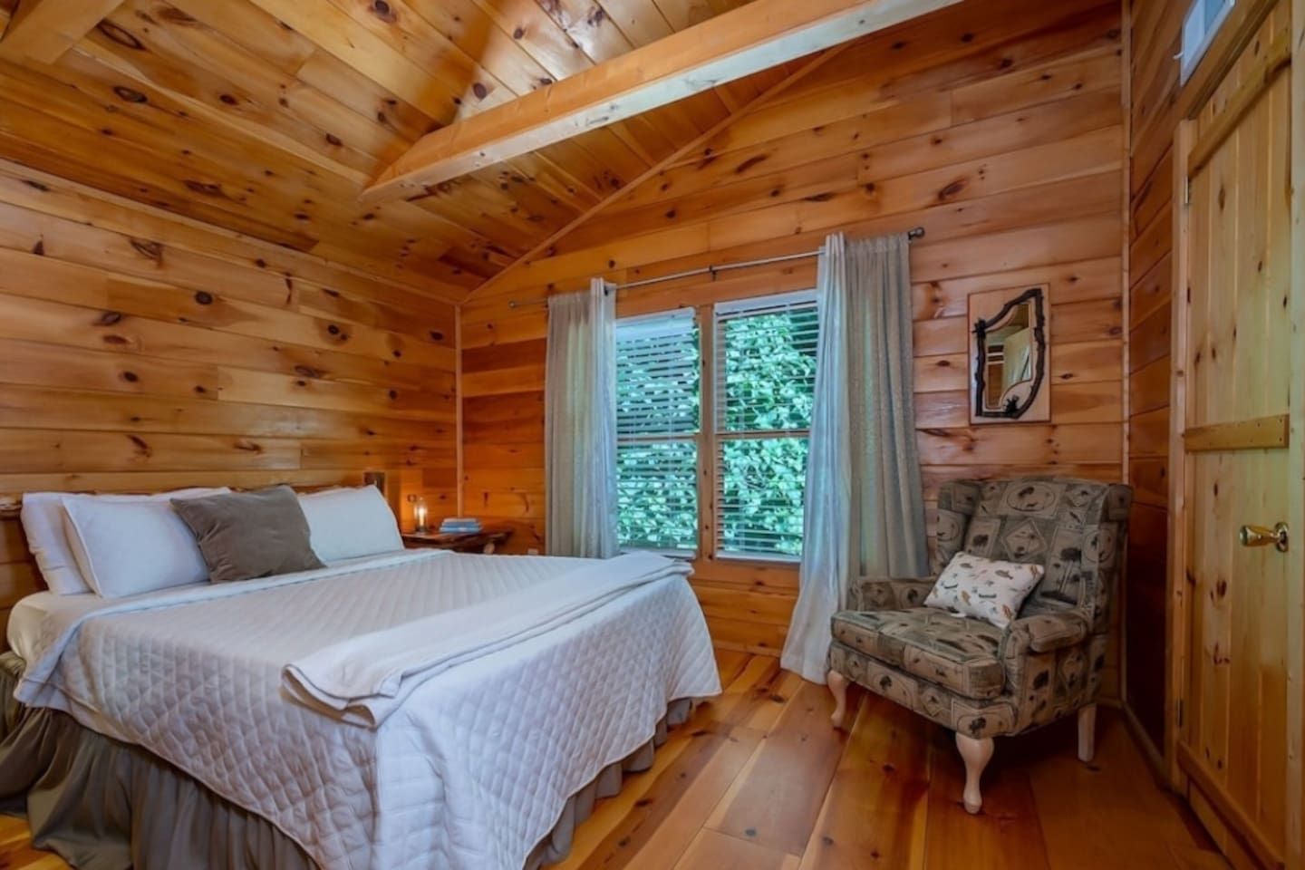 Master Suite two upstairs with full bath and hand carved stone spa shower.