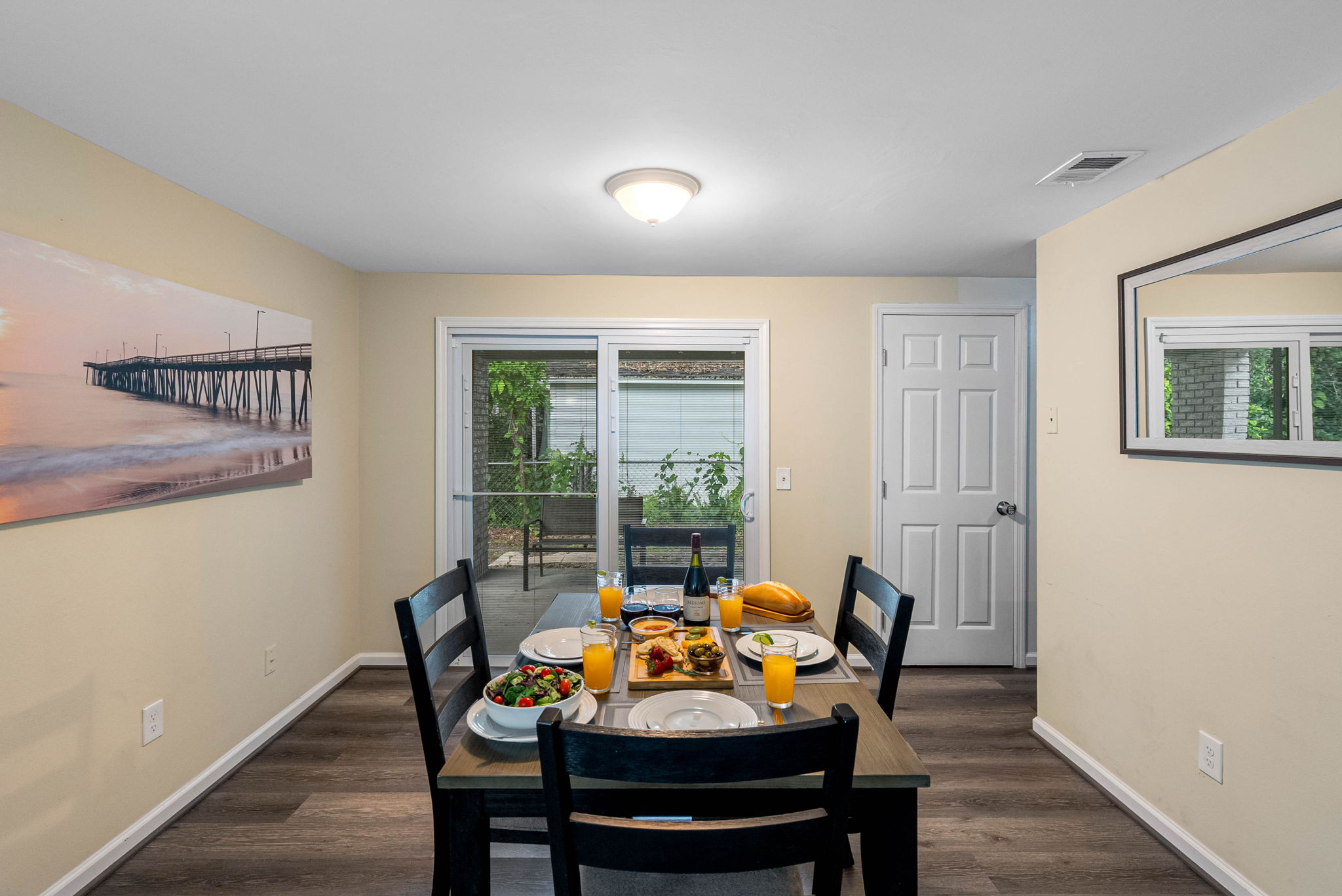 This charming dining space is the heart of the home—perfectly positioned between the main entry and cozy living room for both convenience and comfort.