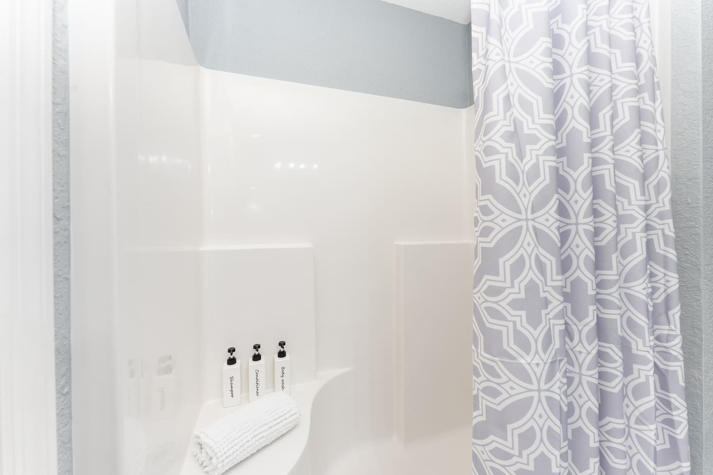 Complimentary shampoo, conditioner, and body wash are provided.