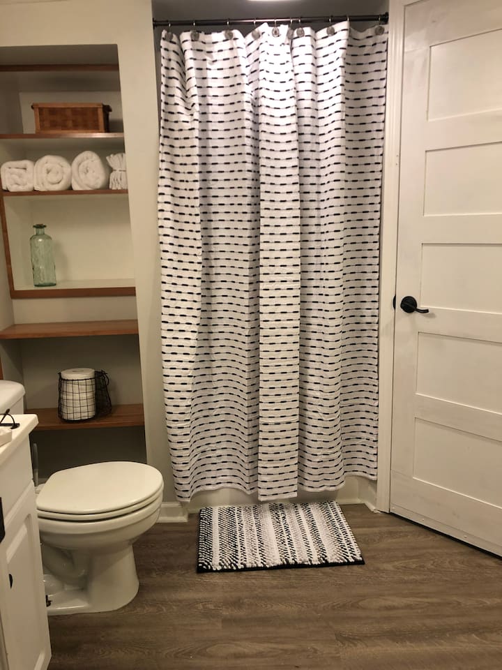 Newly renovated bathroom with shower, new floors and built in storage give you plenty of room to unpack and get comfy. 