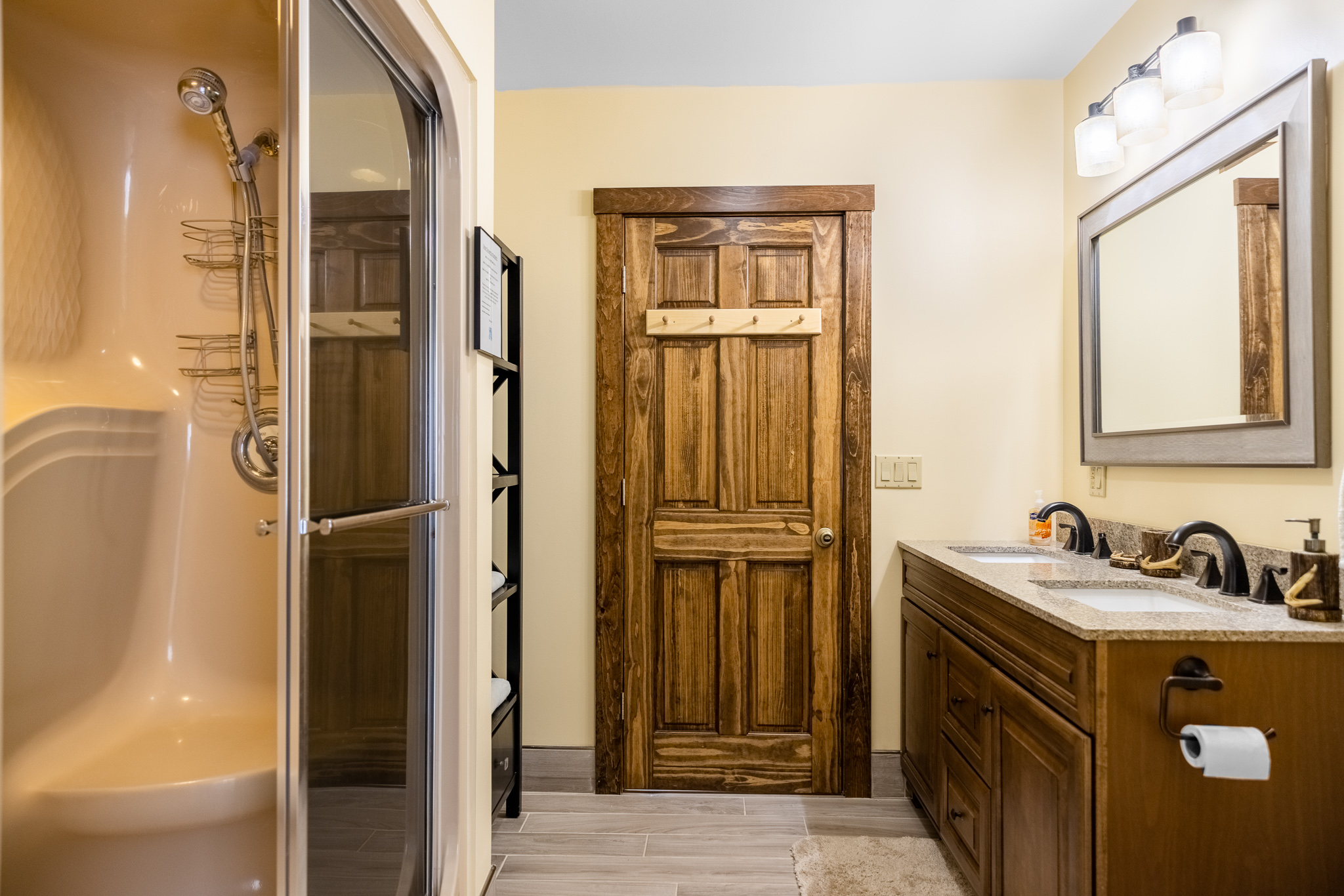 Main floor bathroom, double sinks, steam shower.