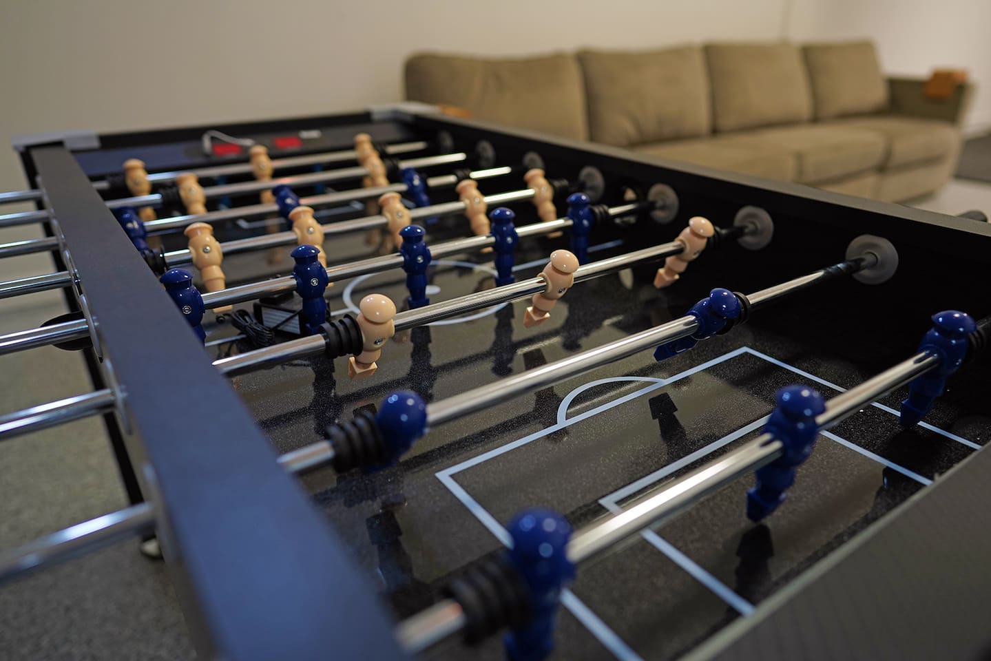 Air conditioned and heated garage space includes tons of games like foosball, air hockey, and shuffleboard.